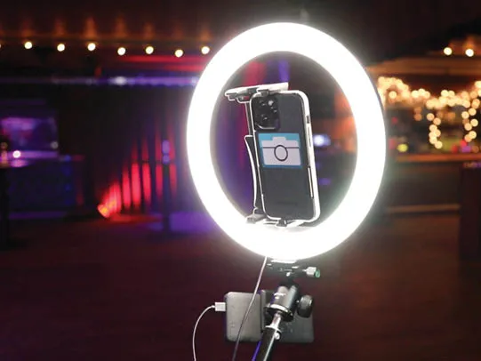 Close-up of 360 camera and ring light with NEPB branding