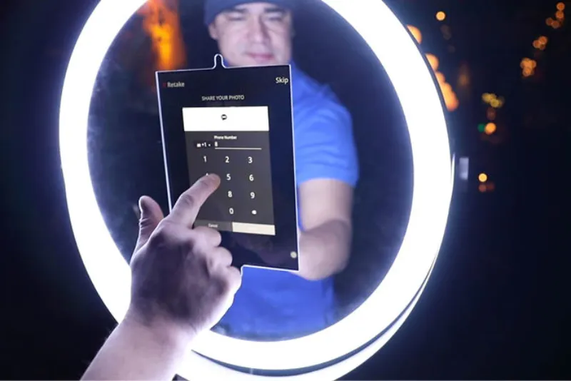 Guests using GIF booth sharing station to send animated GIFs to friends