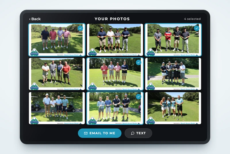 iPad kiosk showing a corporate event photo gallery with photos selected to email
