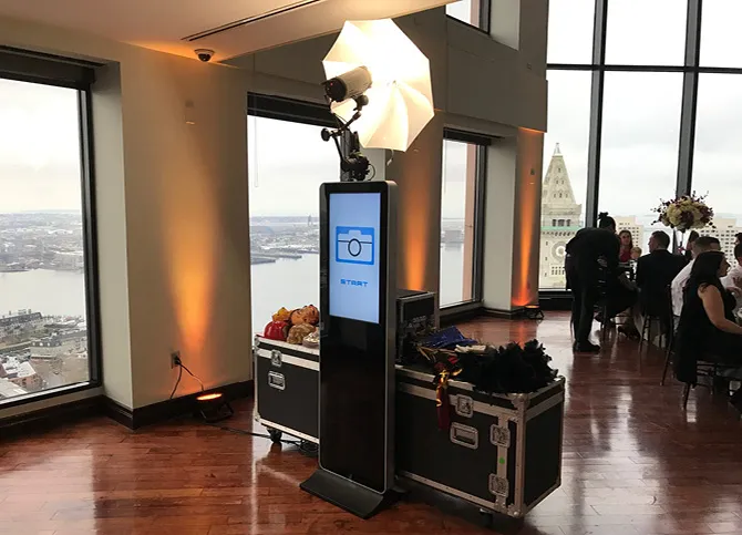 Photo Tower in use by couple with props at a wedding event