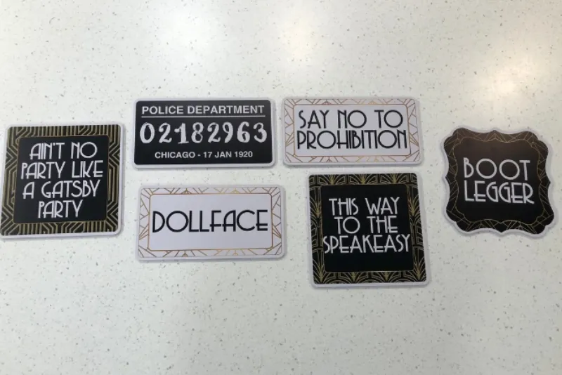 Custom roaring 20s themed photo booth prop signs