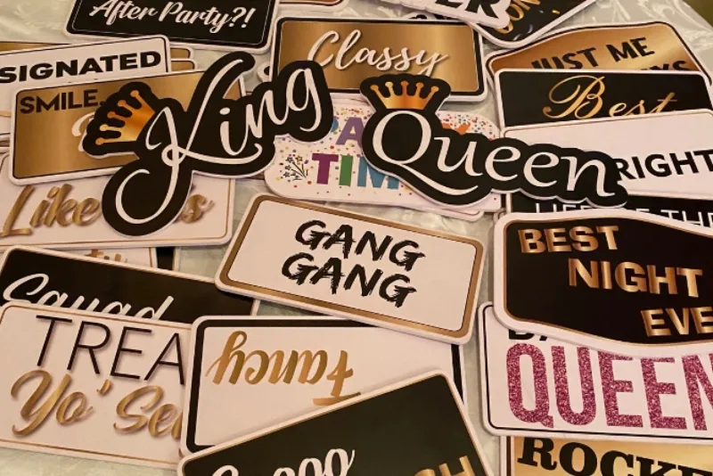 Standard black and gold handheld photo booth prop signs