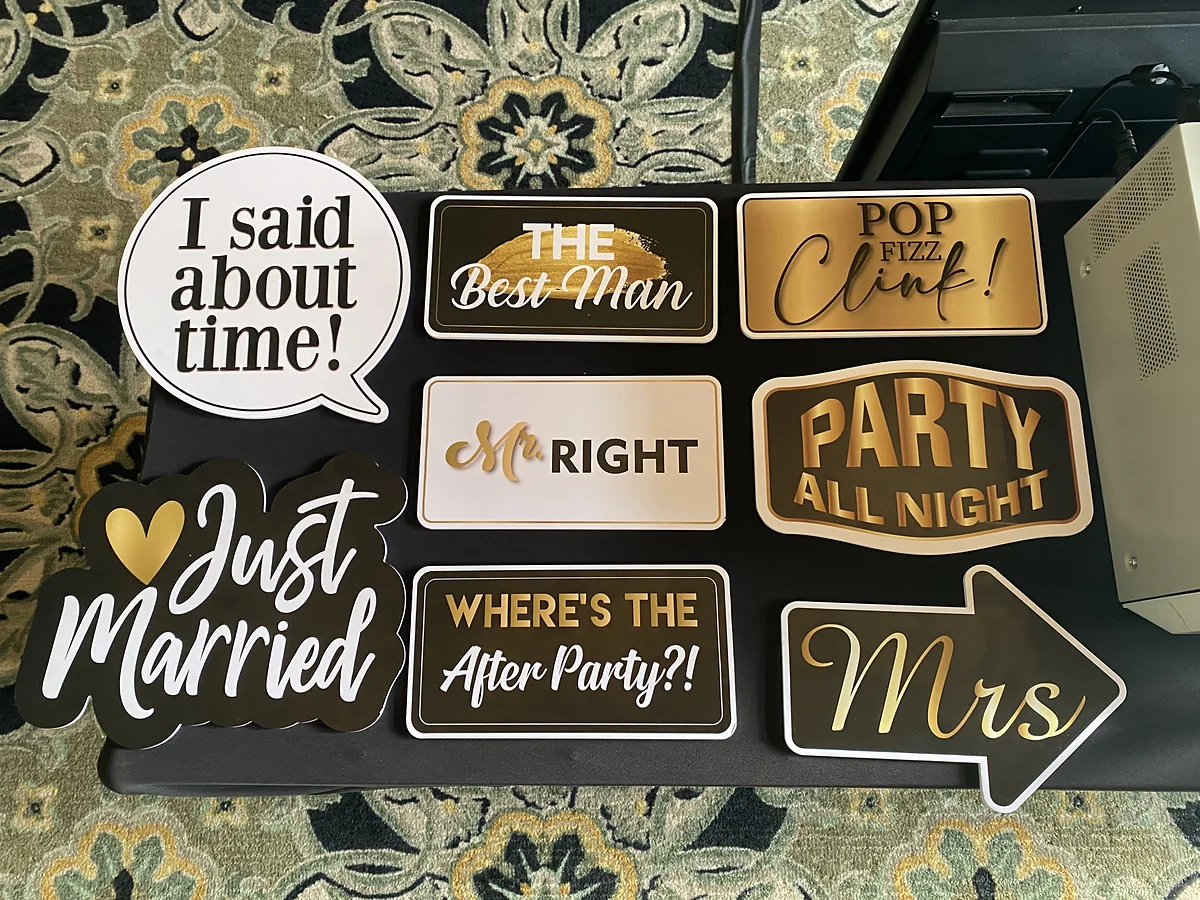 Wedding photo booth prop signs reading Just Married, Mrs, The Best Man, Mr Right and Where's the After Party
