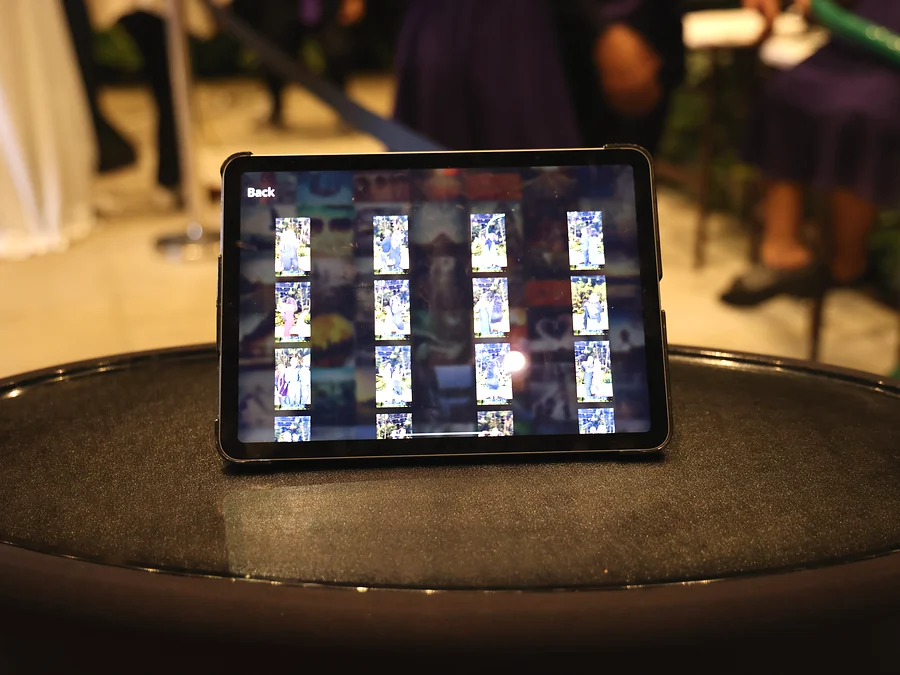 iPad sharing station displaying the event photo gallery at a reception