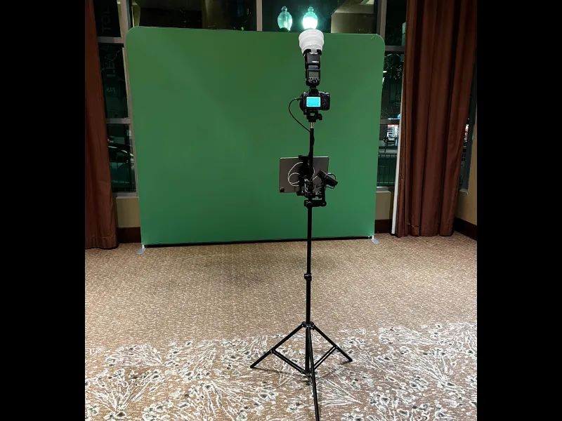Guest using the HD Tripod Pro booth with props