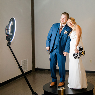 Bride and Groom using 360 Booth