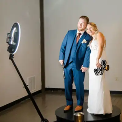 Bride and groom on the 360 booth platform
