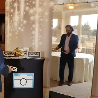 Guest choosing a prop sign at the Mirror Booth