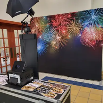 Open air photo booth with backdrop, props and sharing station
