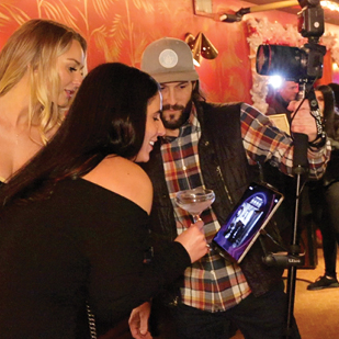 Girl Group Poses for Roaming Photo Booth