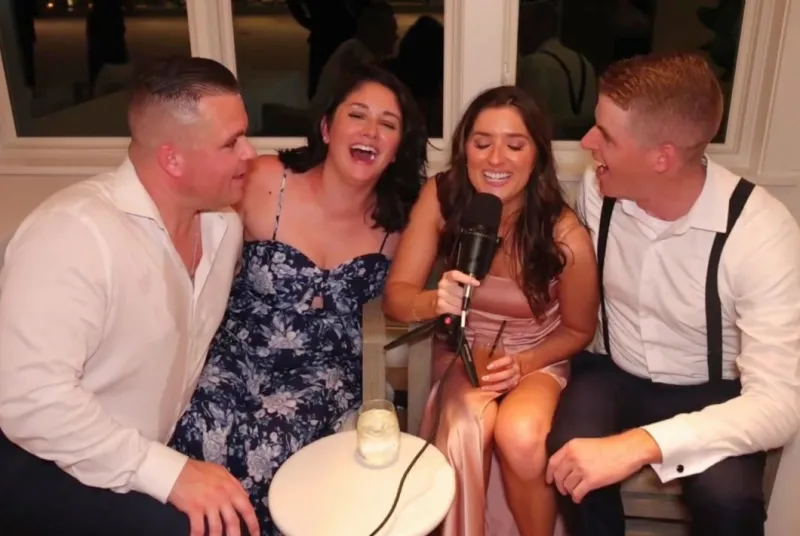 Guest recording a heartfelt video message at the Confessional Booth