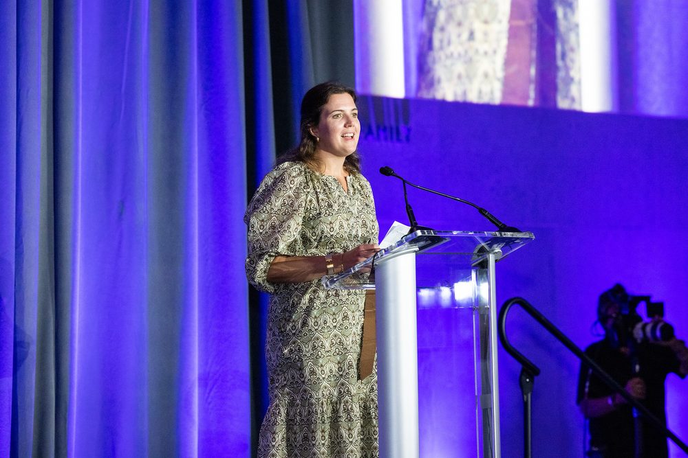 Keynote speaker photographed at a corporate awards gala