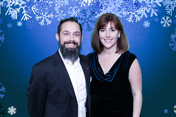 Snowflake green screen background with couple at corporate party