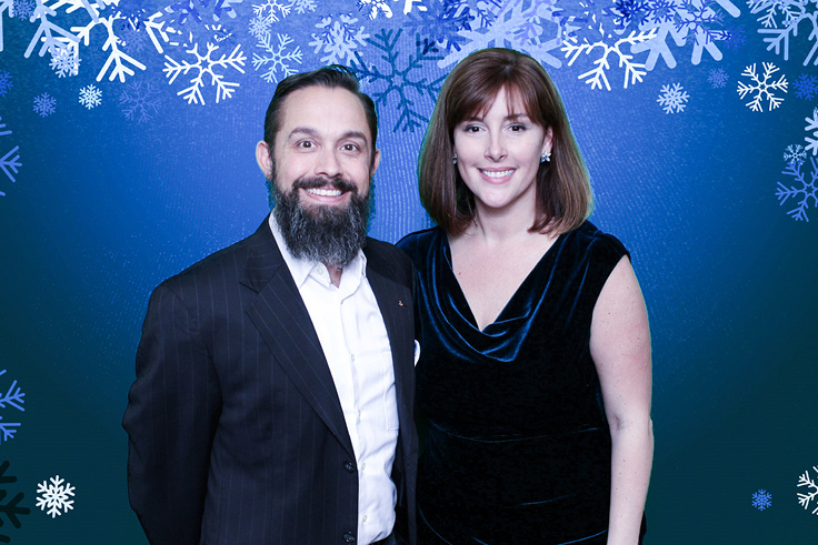 Snowflake green screen background with couple at corporate party
