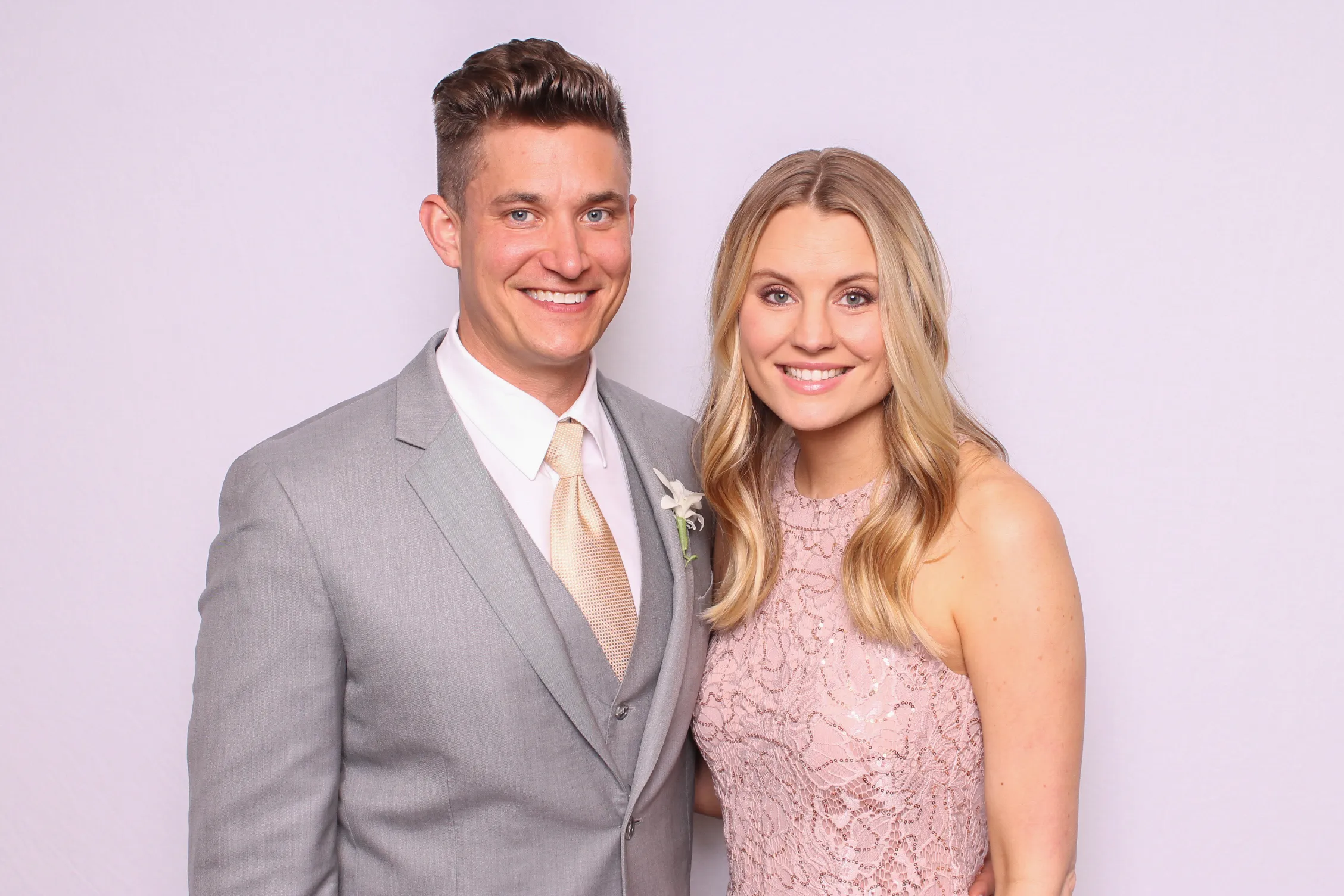 Couple smiling at wedding photo booth