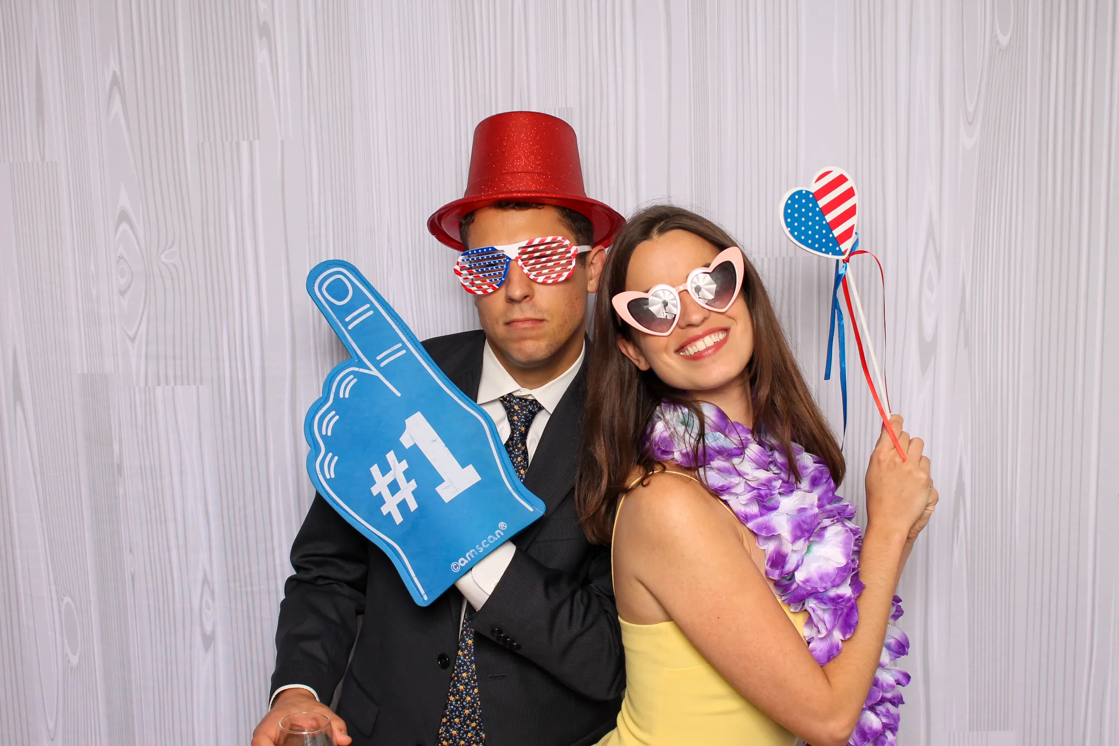 Guests posing at party photo booth
