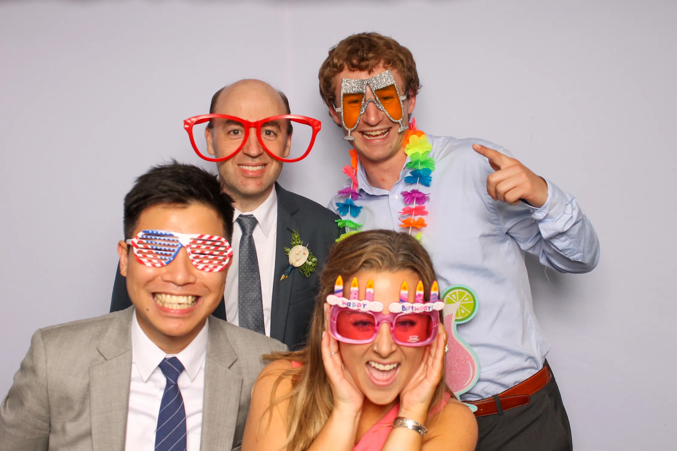 Birthday guests posing at photo booth
