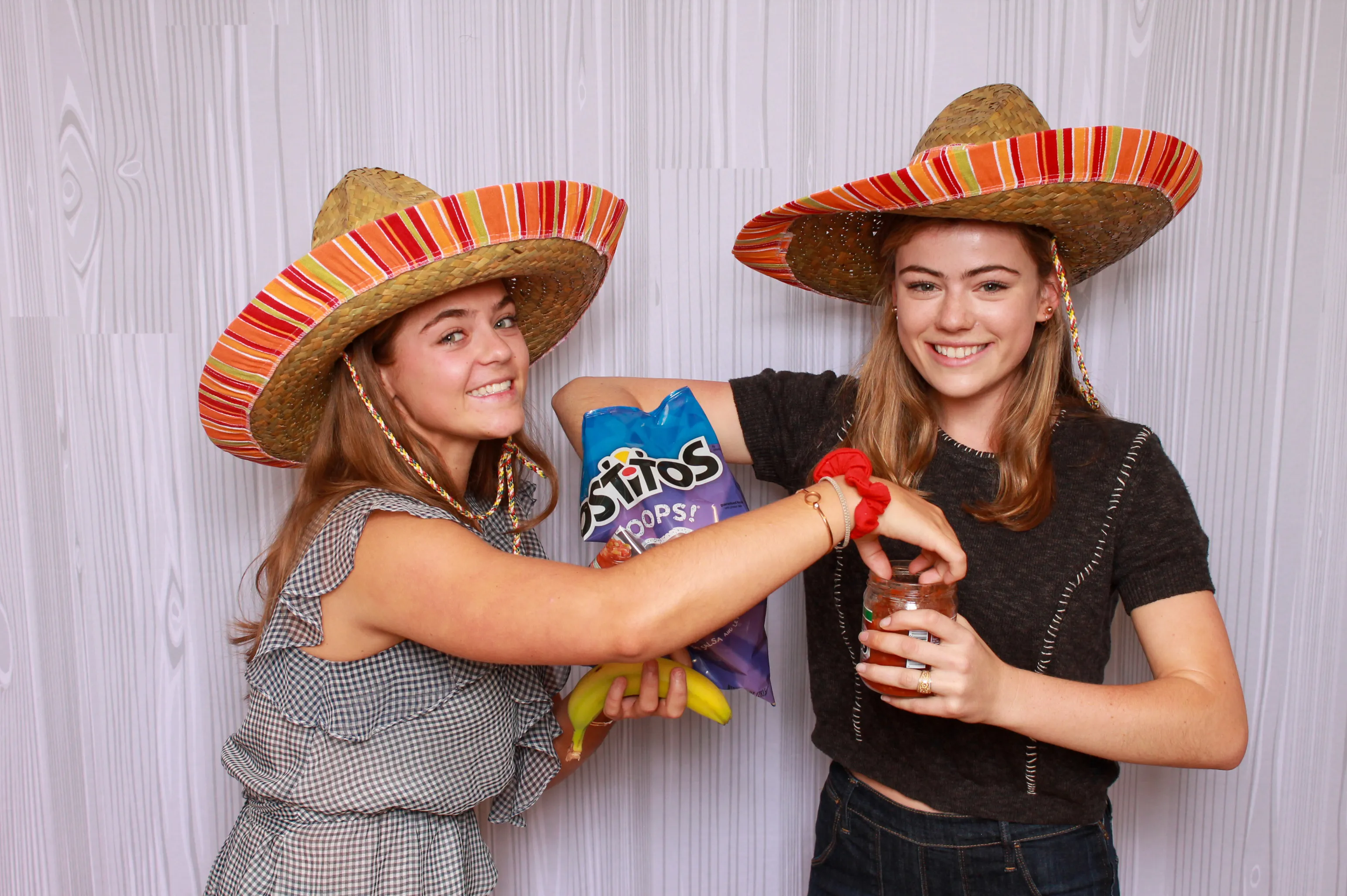Party guests posing at photo booth