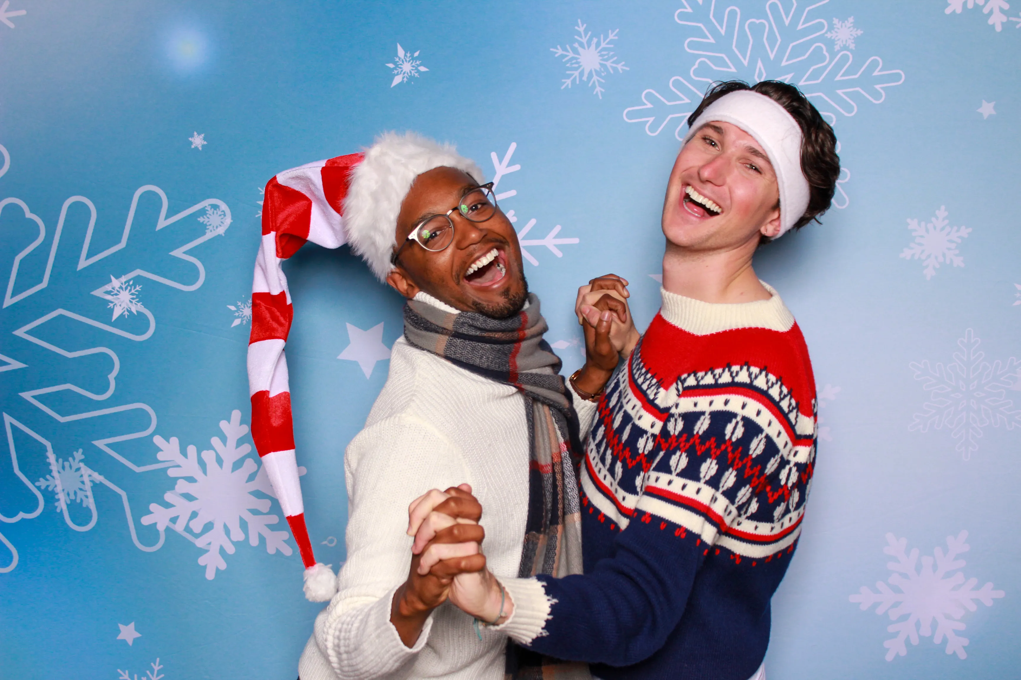 Guests laughing at party photo booth
