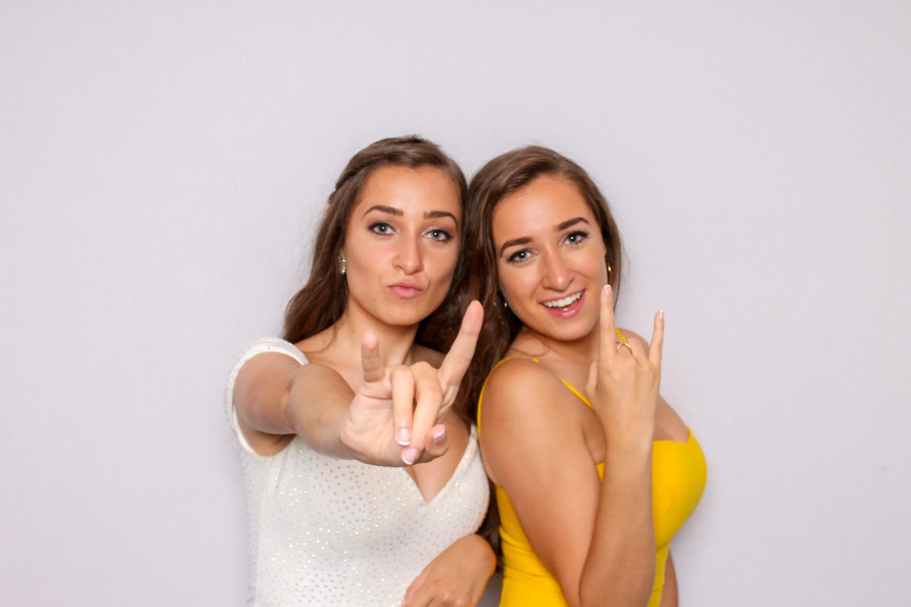 Students posing at school photo booth