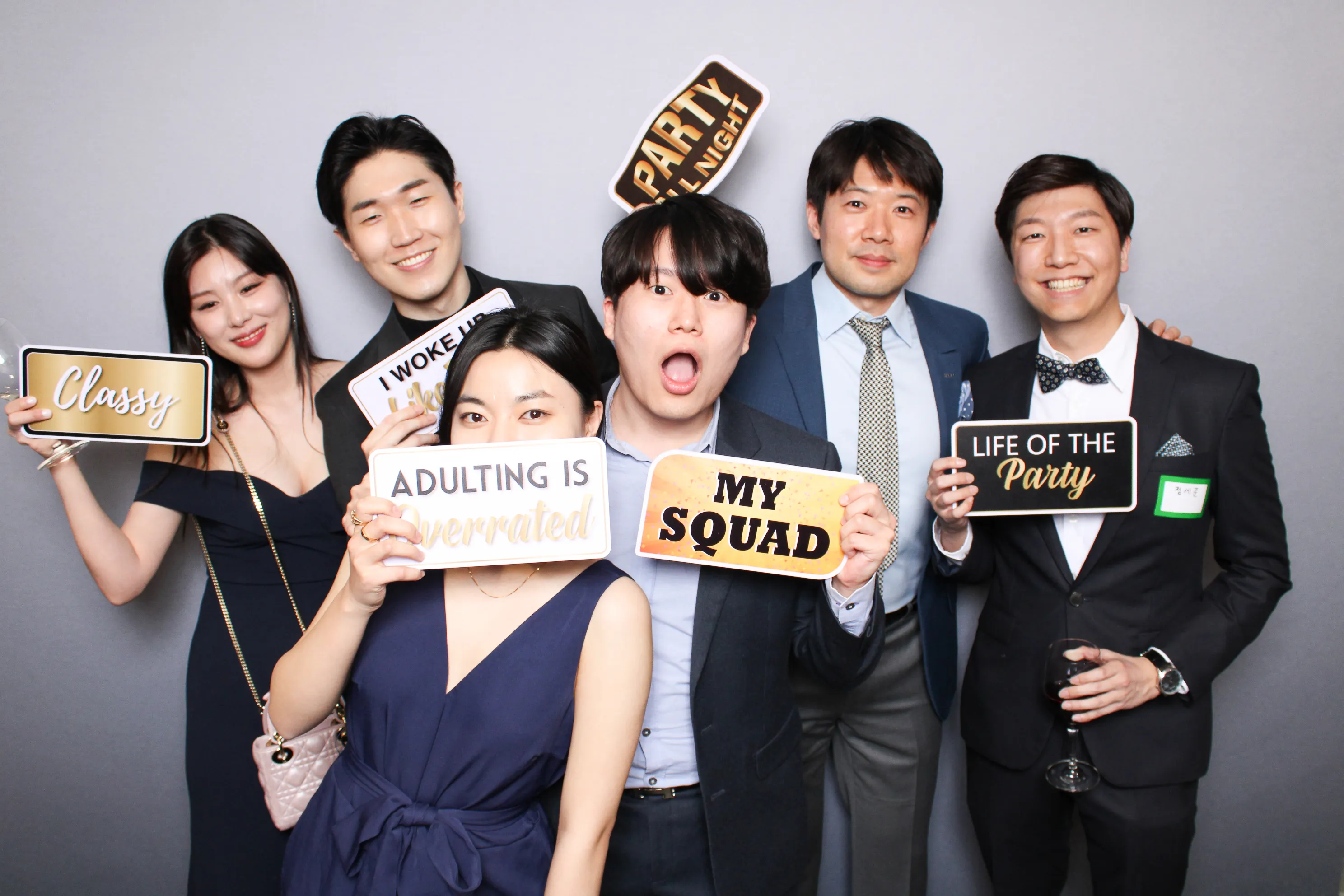 Couple posing together at wedding photo booth