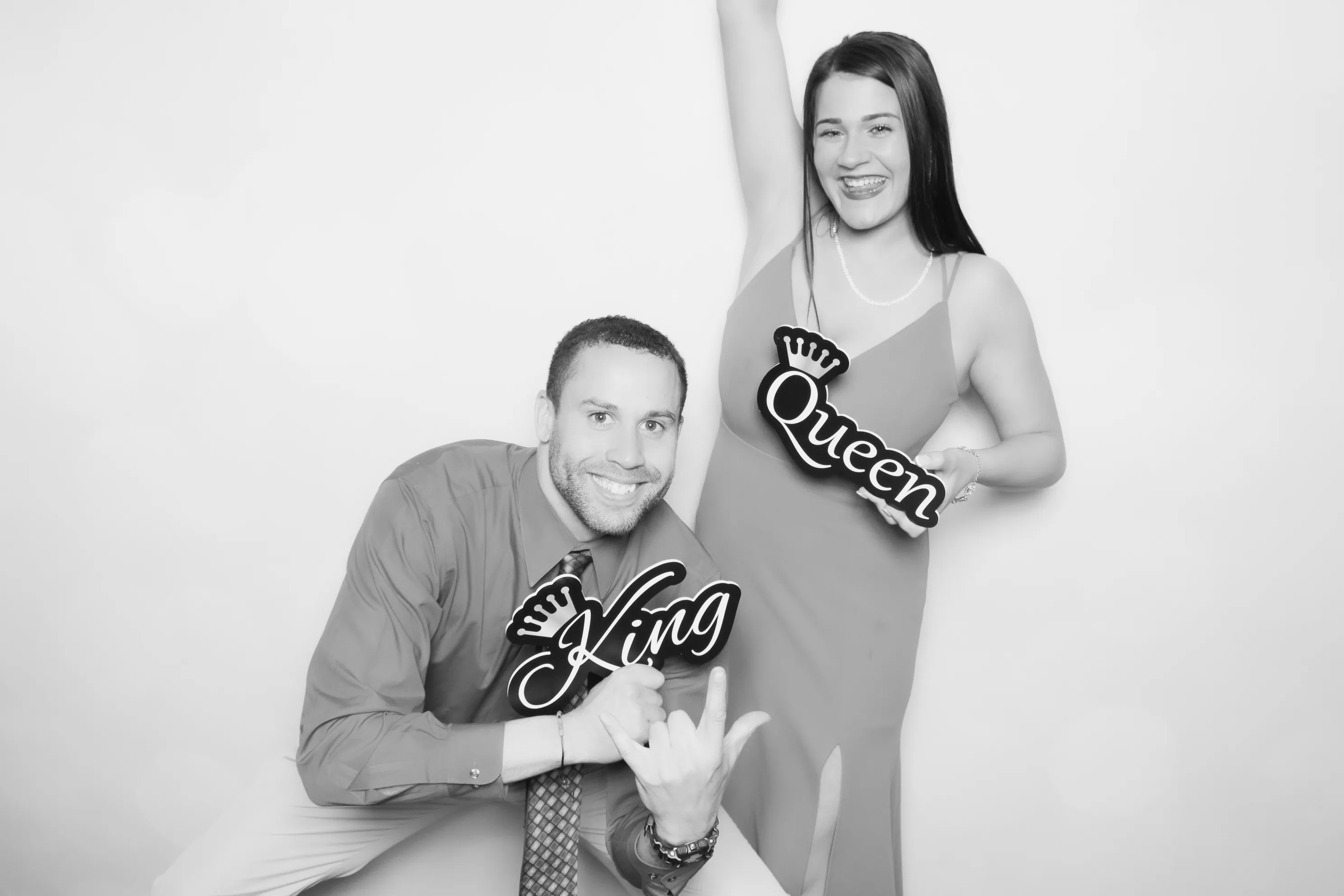 Guests laughing and posing at open air photo booth