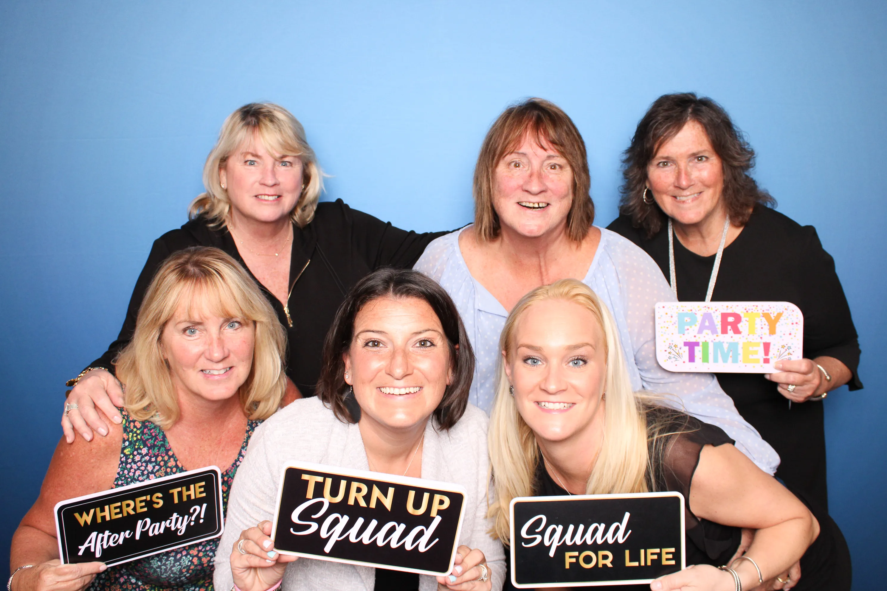 Wedding guests smiling at photo booth