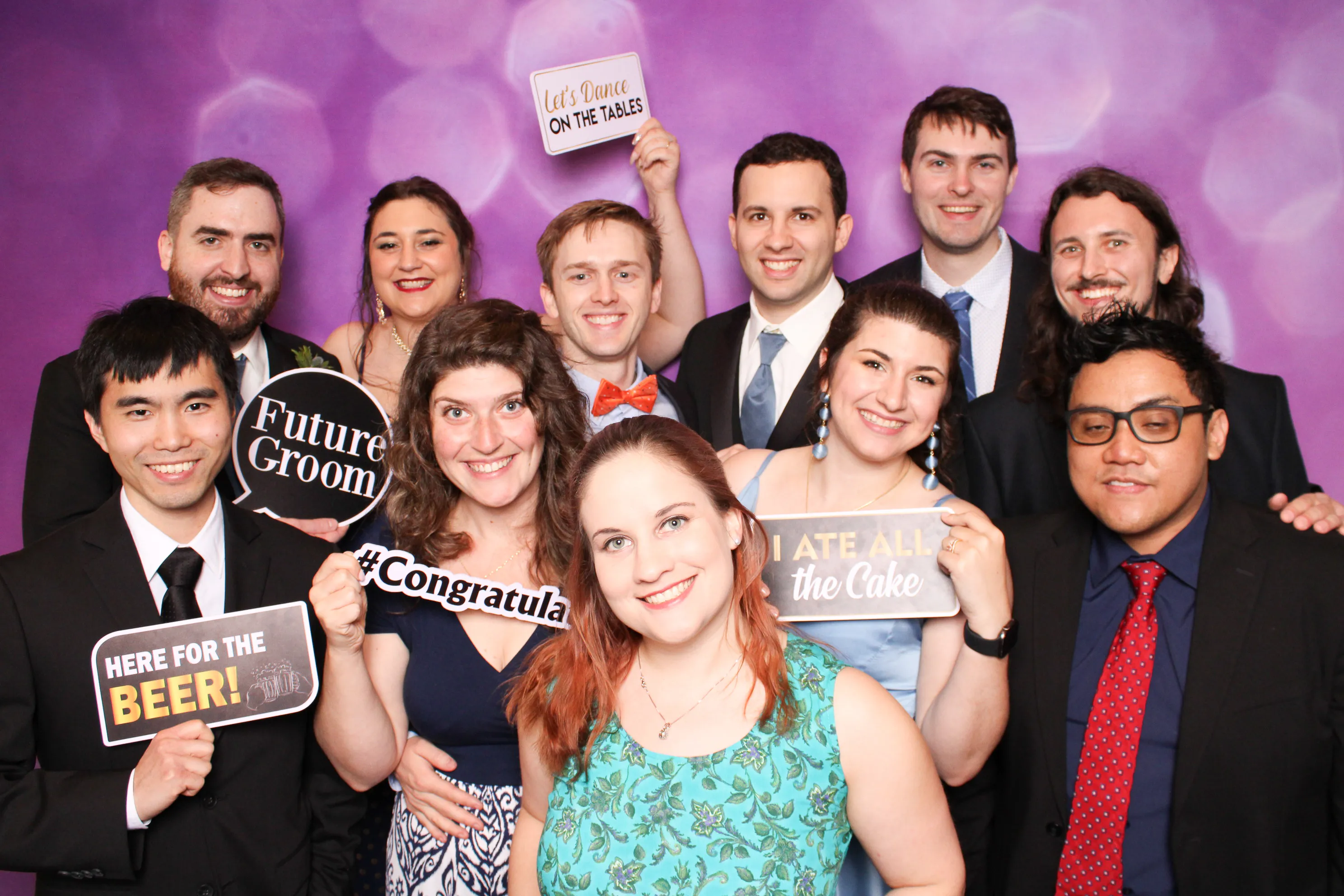 Students striking a pose at school event photo booth