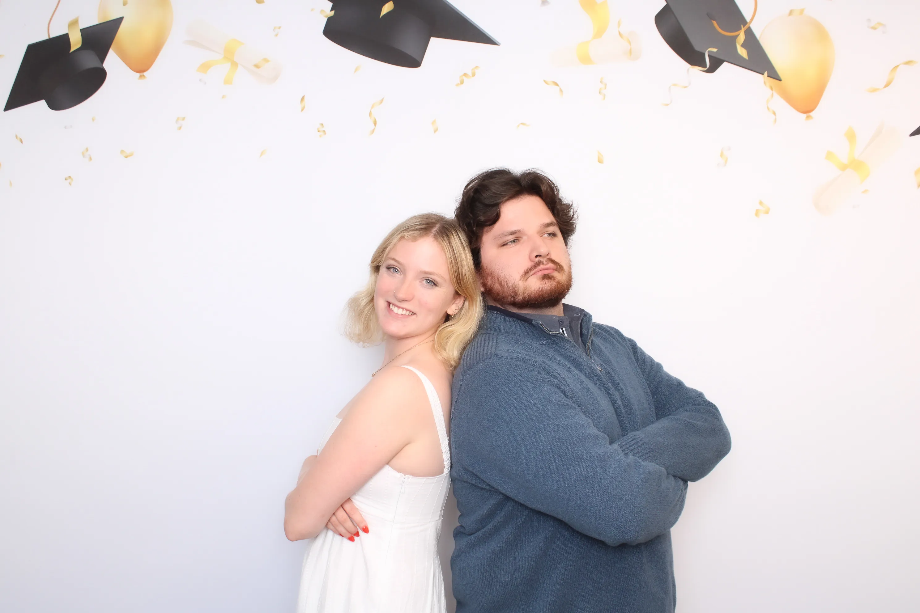 Group of friends posing at party photo booth
