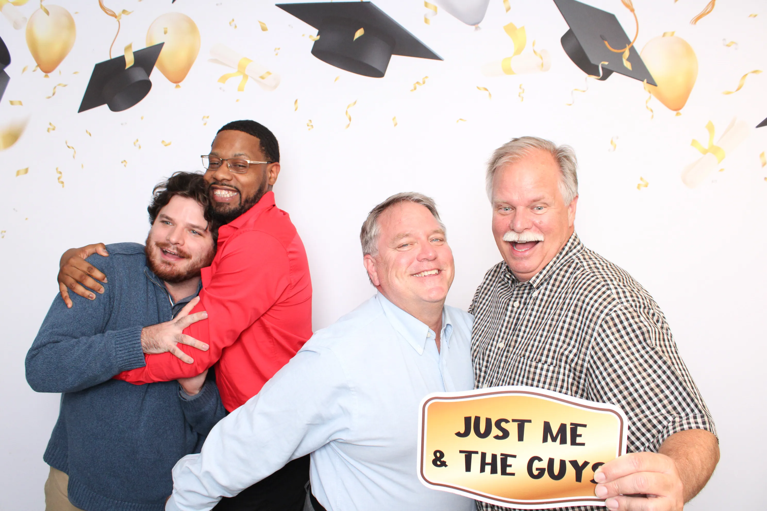 Wedding party posing together at photo booth