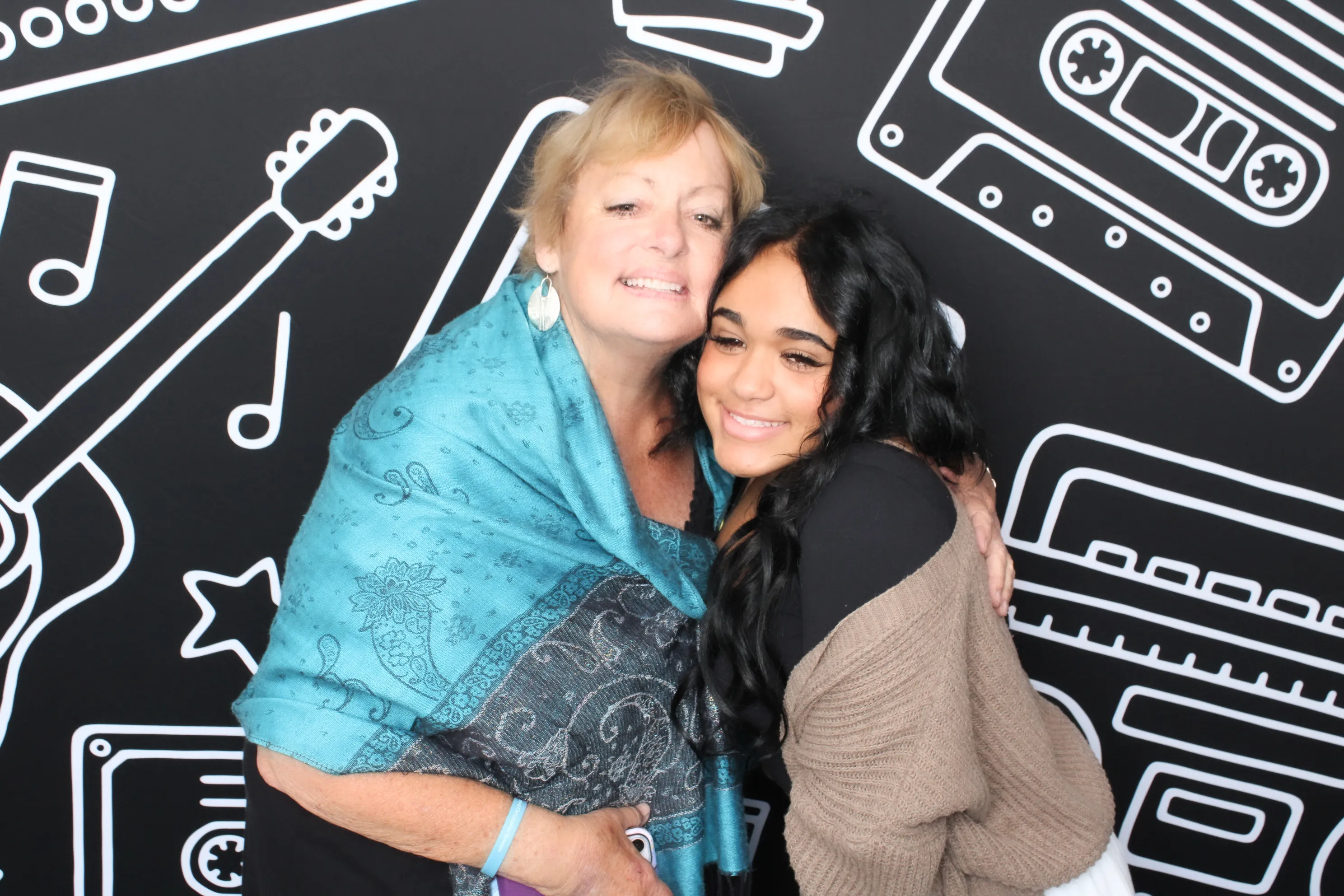 Sweet 16 guests posing at birthday photo booth