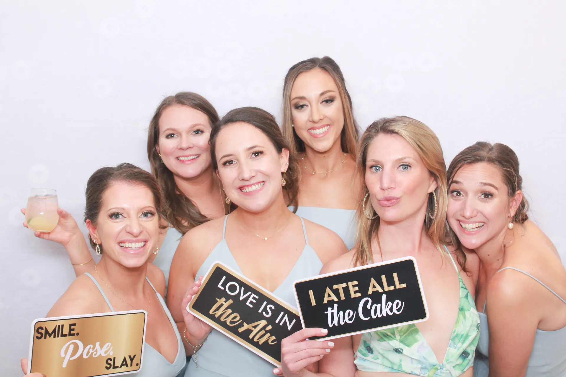 Prom couple posing at school dance photo booth