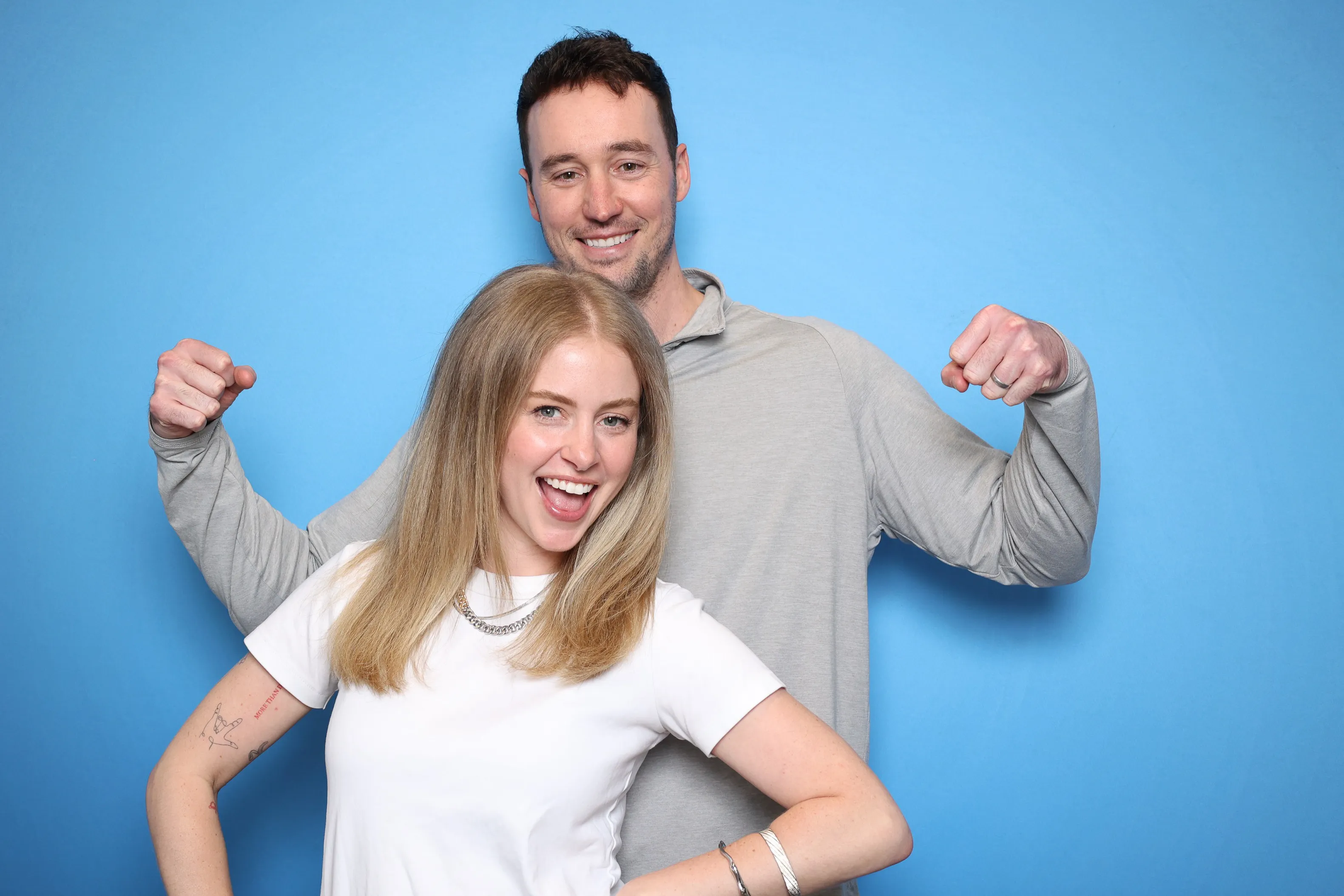 Group of guests having fun at event photo booth