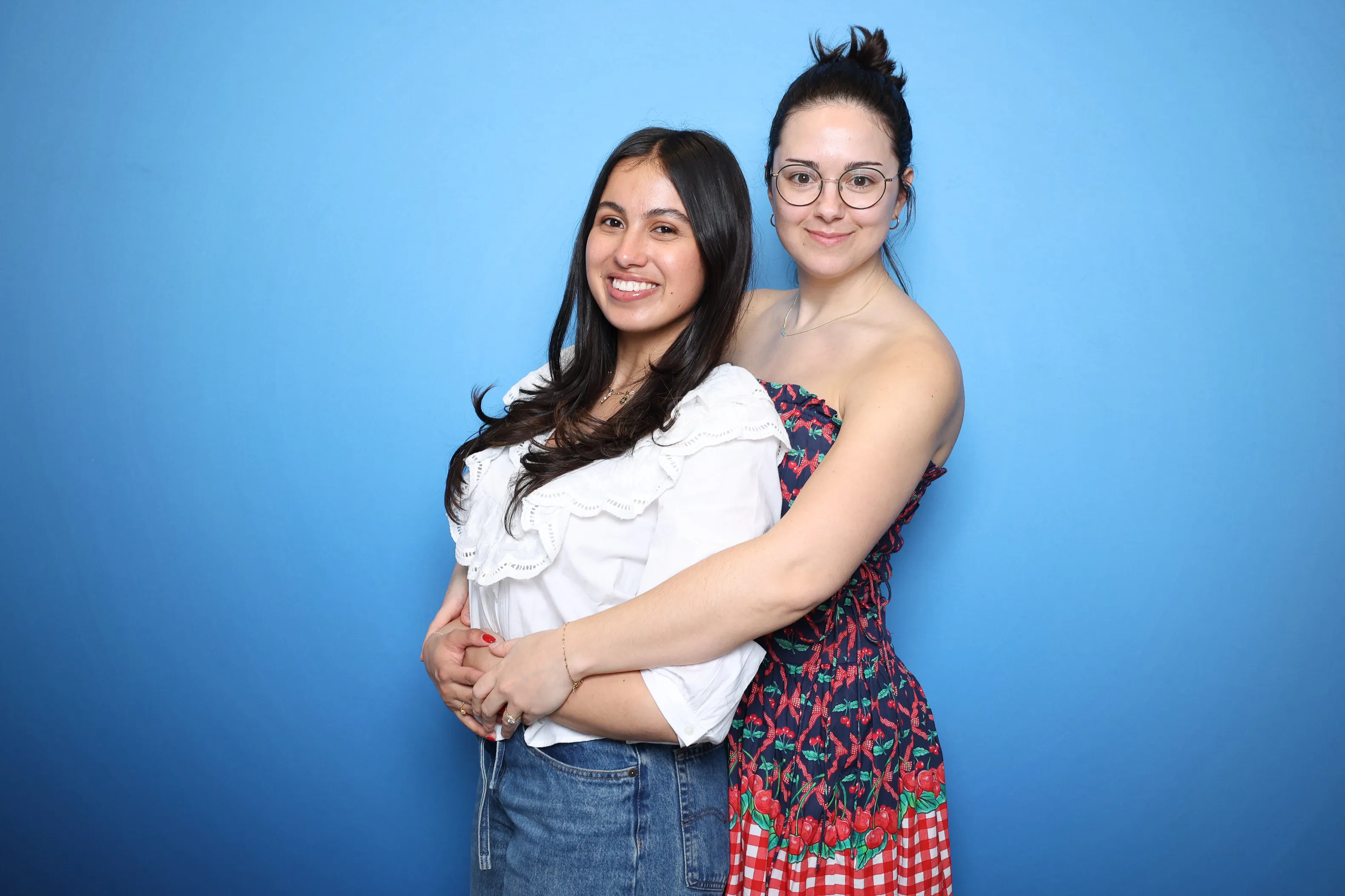 Guests posing with props at photo booth