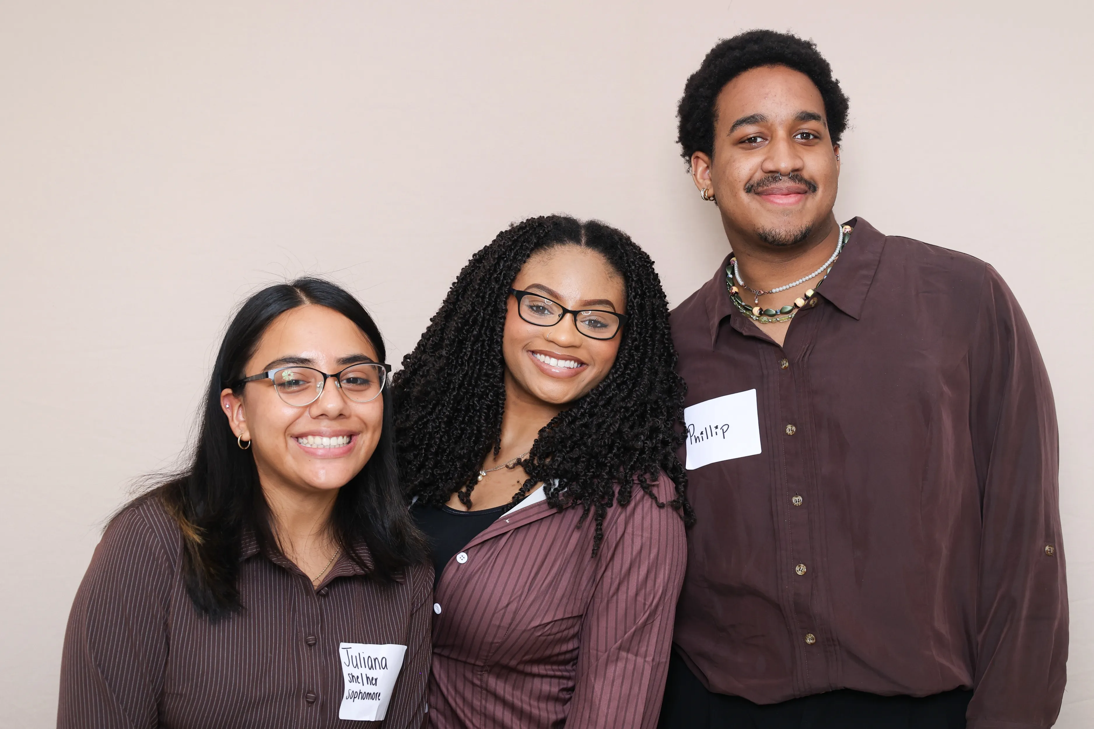 Friends laughing at party photo booth