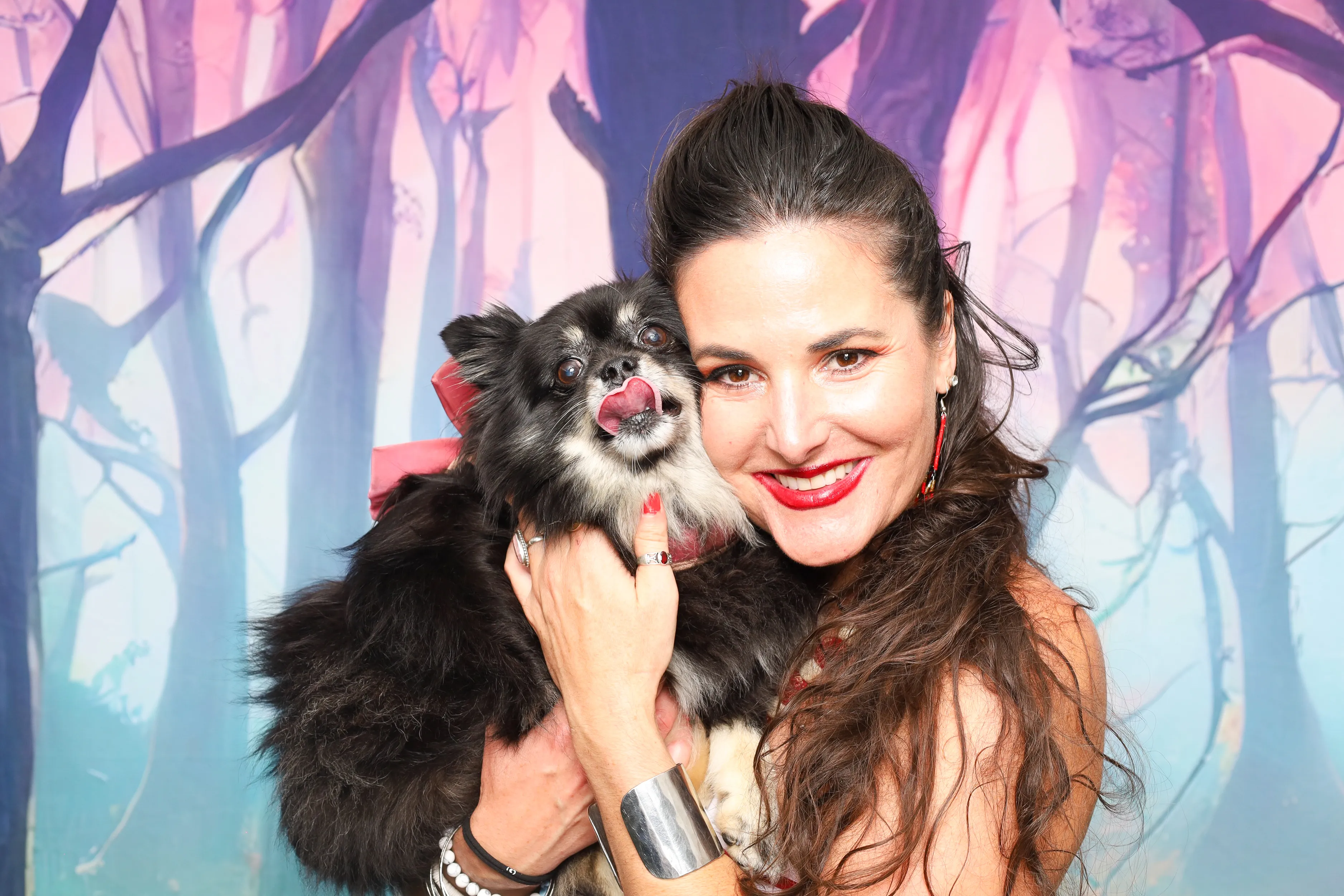 Guests in costumes posing at photo booth
