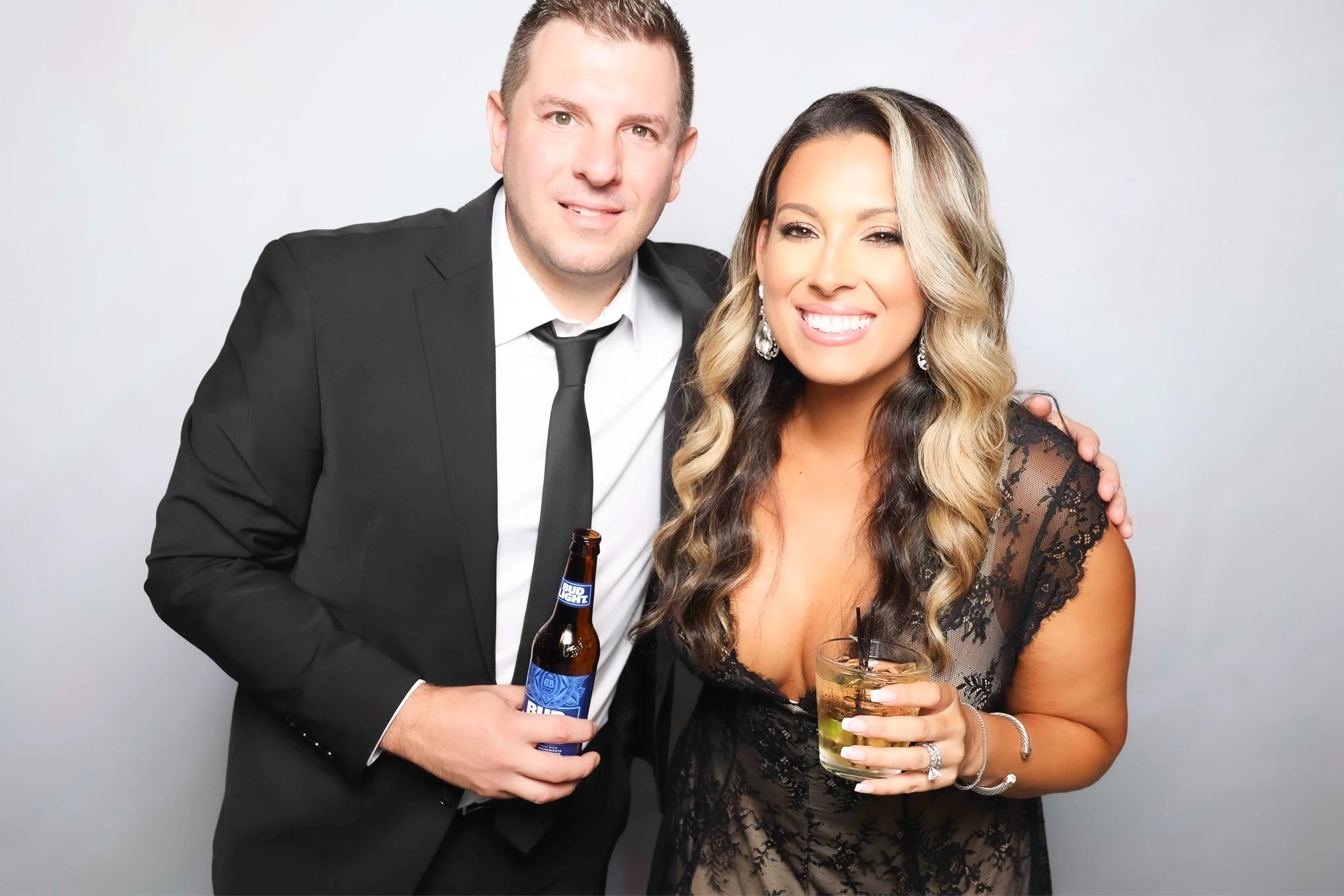 Bride and groom at wedding reception photo booth