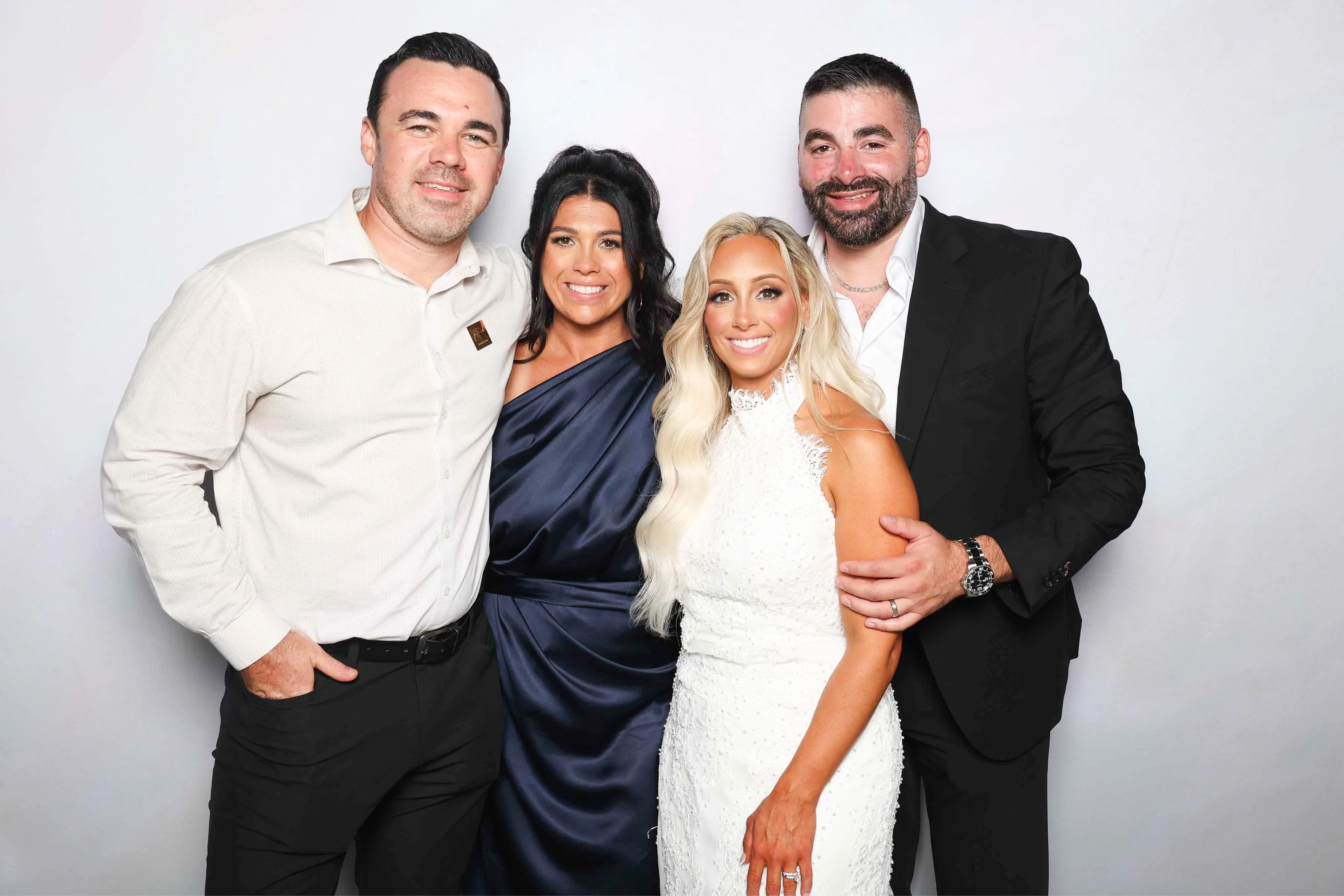 Wedding guests laughing at photo booth
