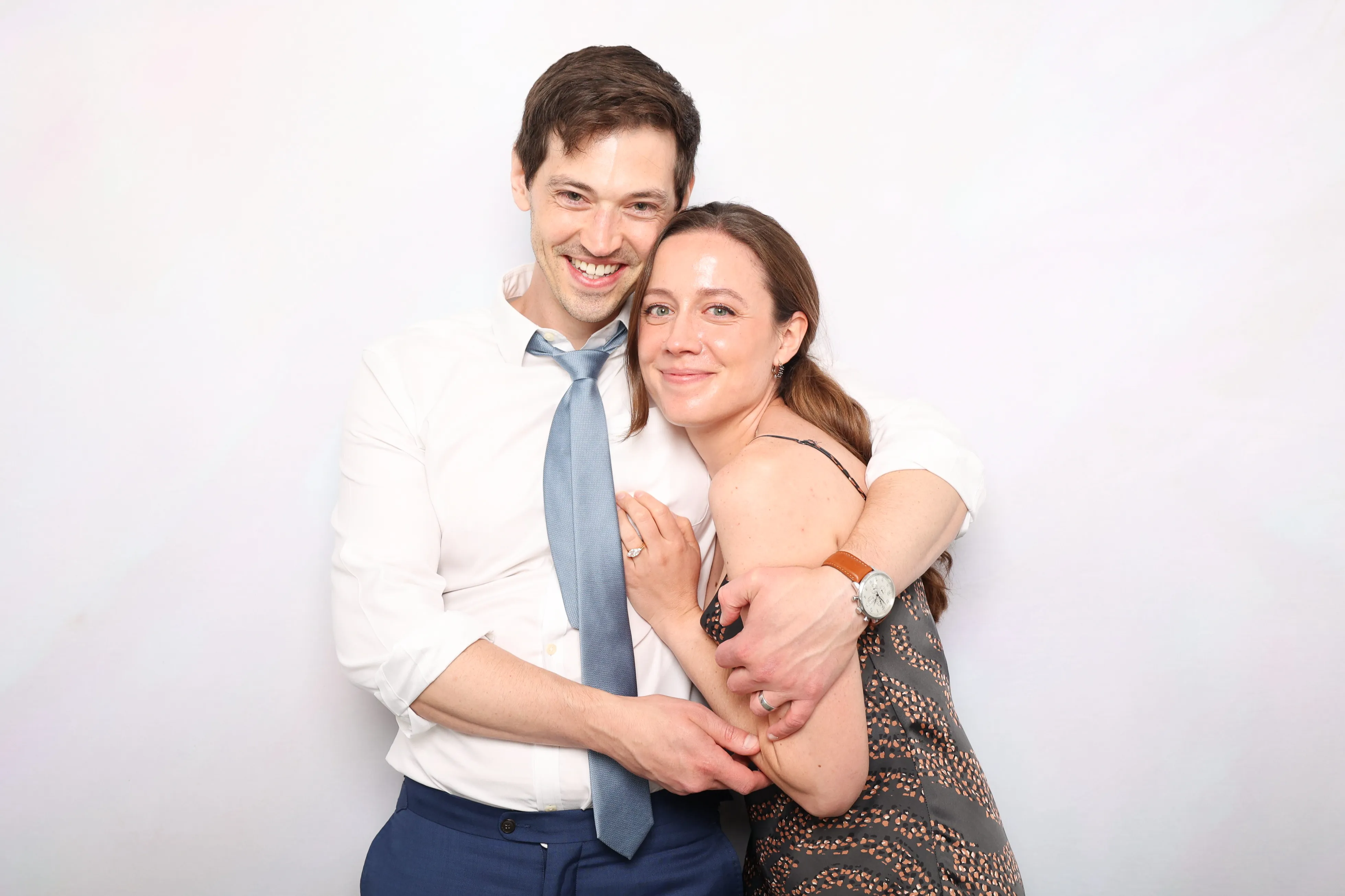 Wedding reception guests enjoying photo booth