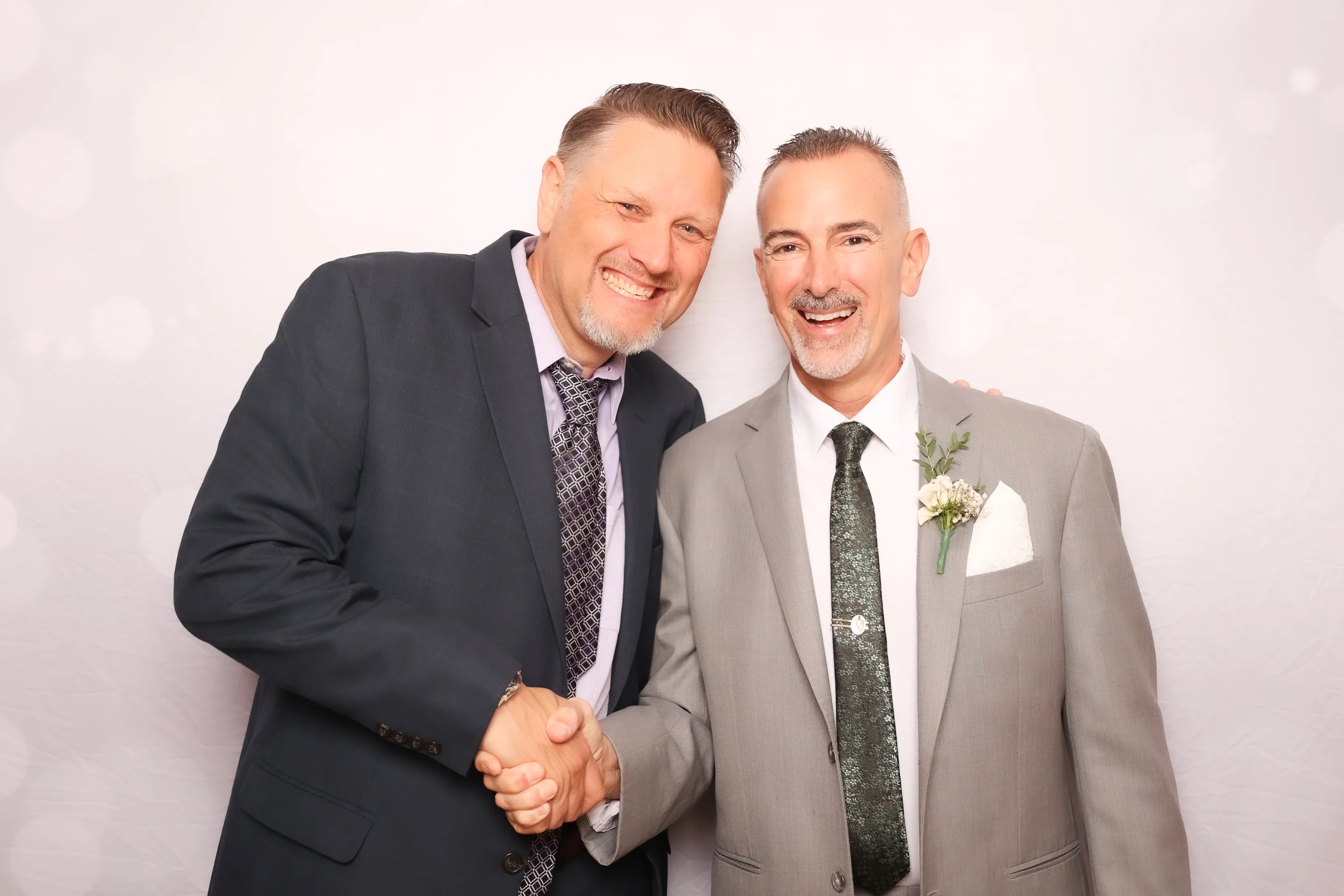 Party guests posing with oversized props