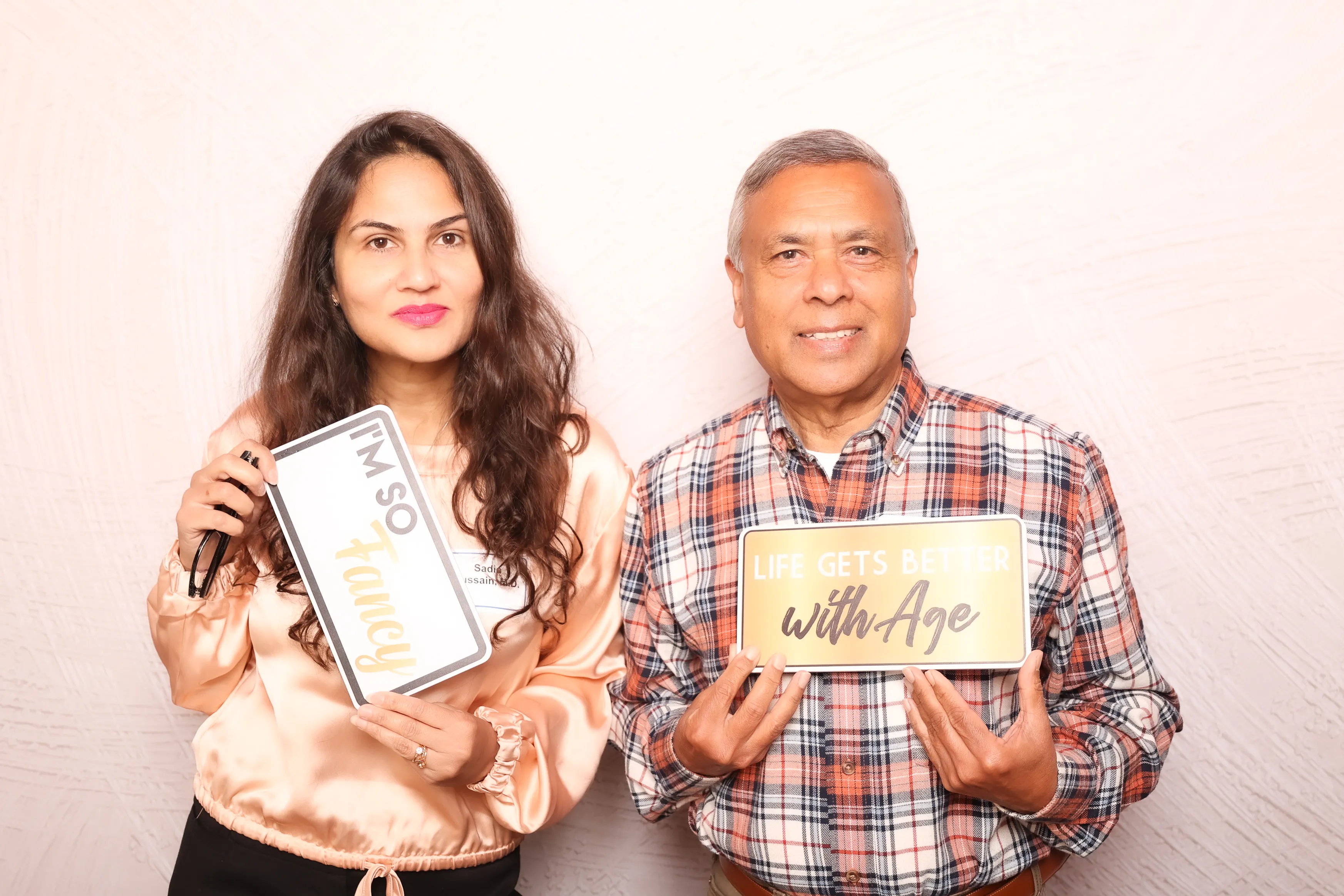 Students at graduation celebration photo booth
