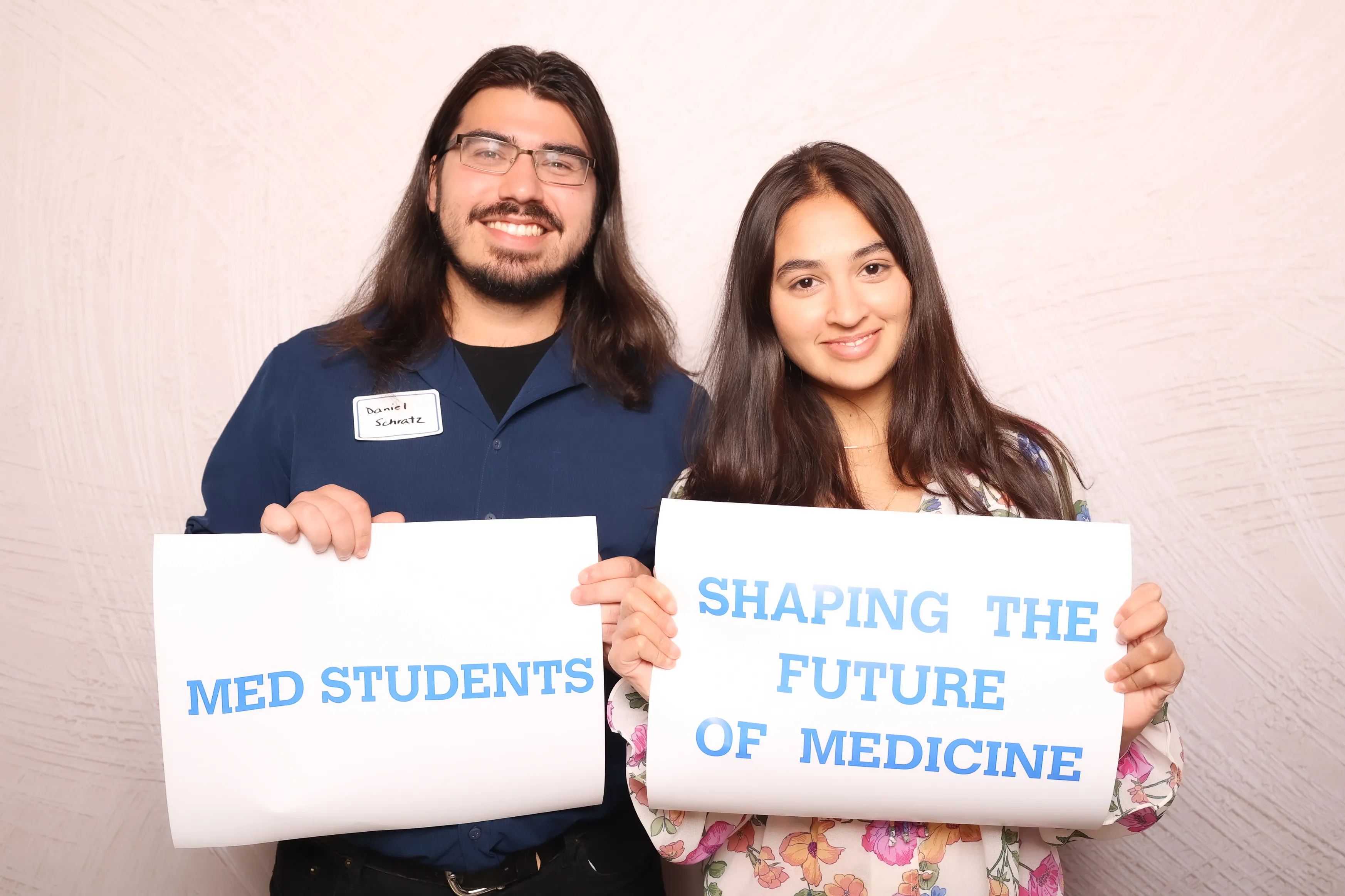 Newlyweds and friends at wedding photo booth
