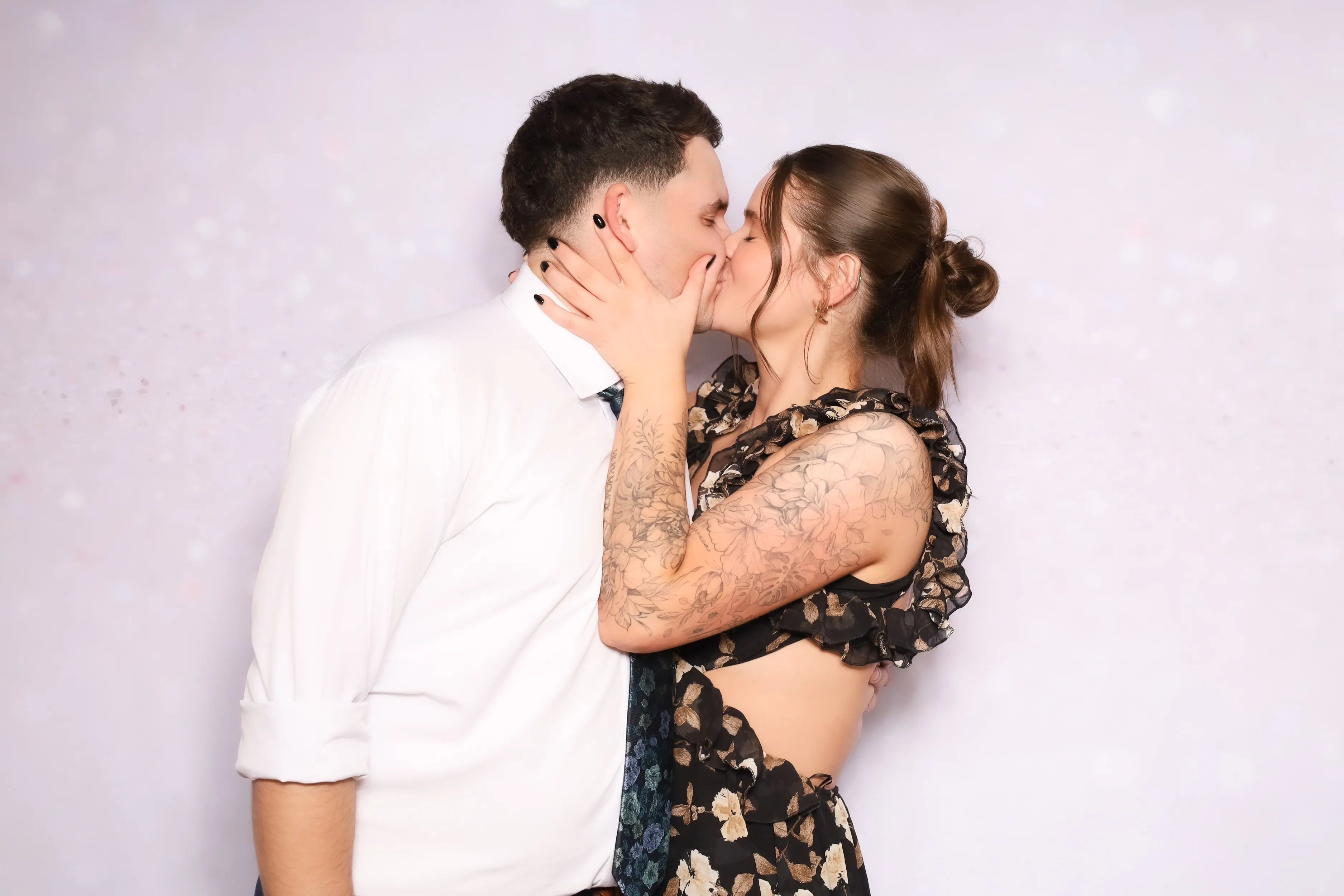 Party guests with fun hats at photo booth