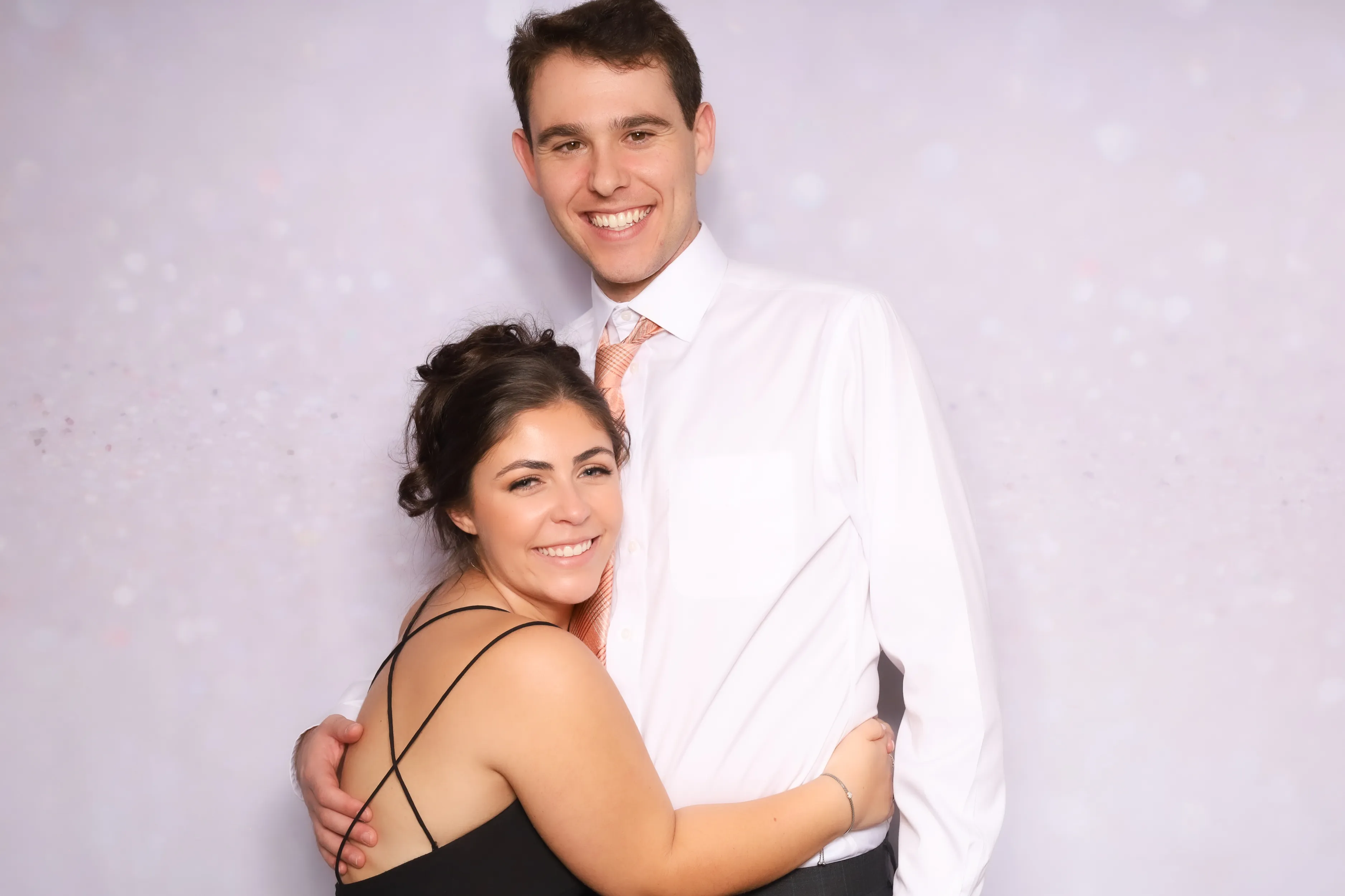 Birthday guests goofing off at photo booth