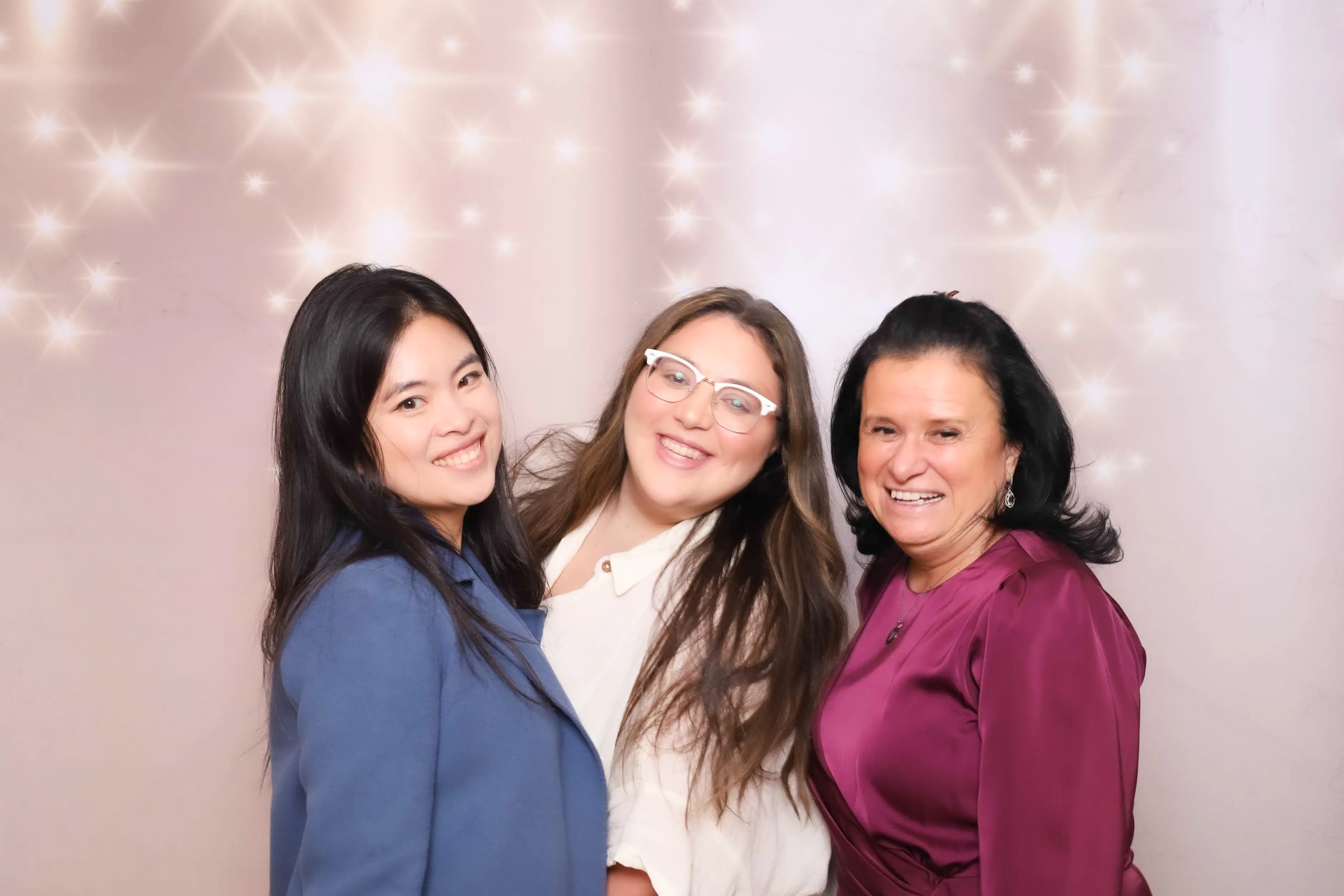 Corporate team celebrating at photo booth