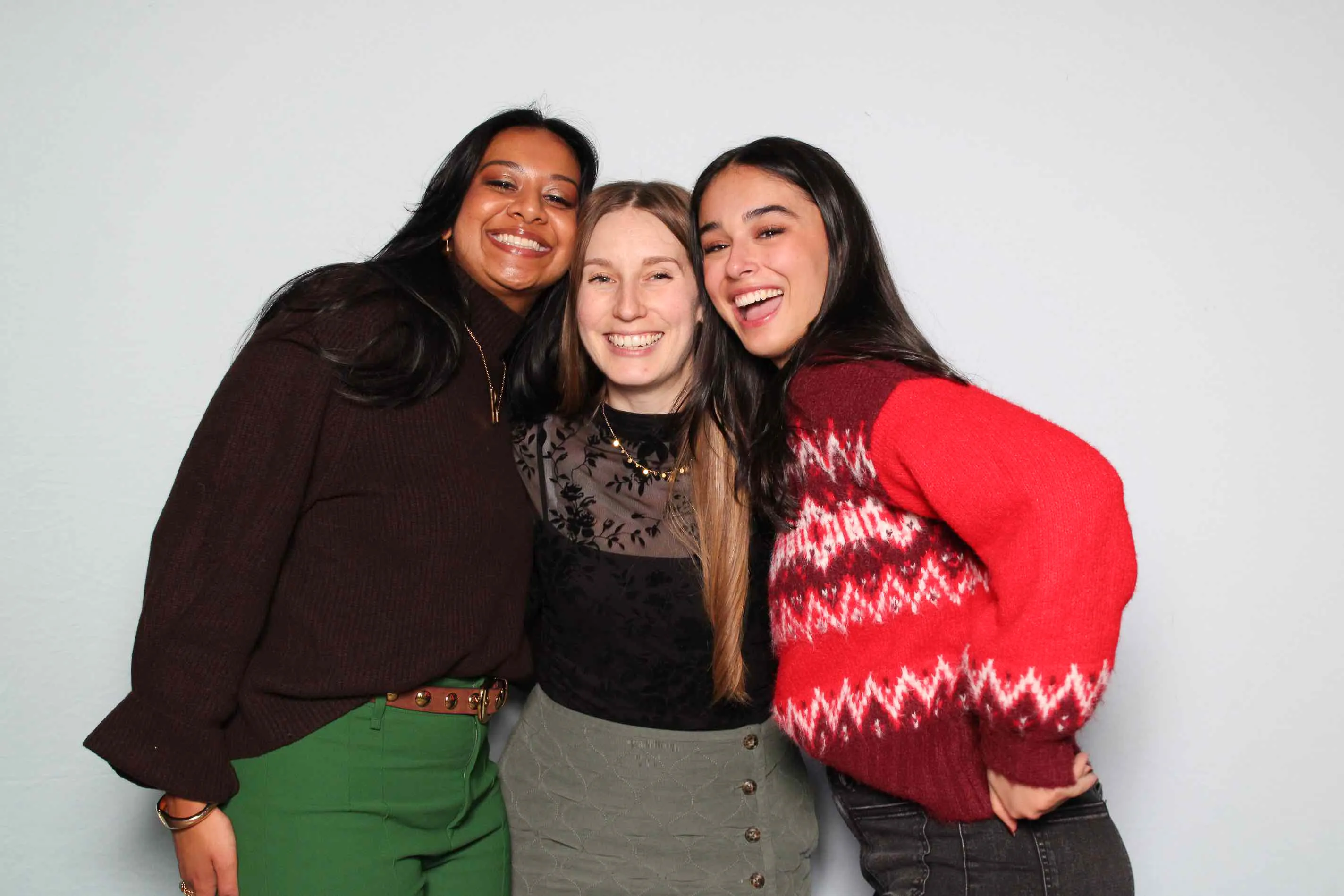 Friends in costume at party photo booth