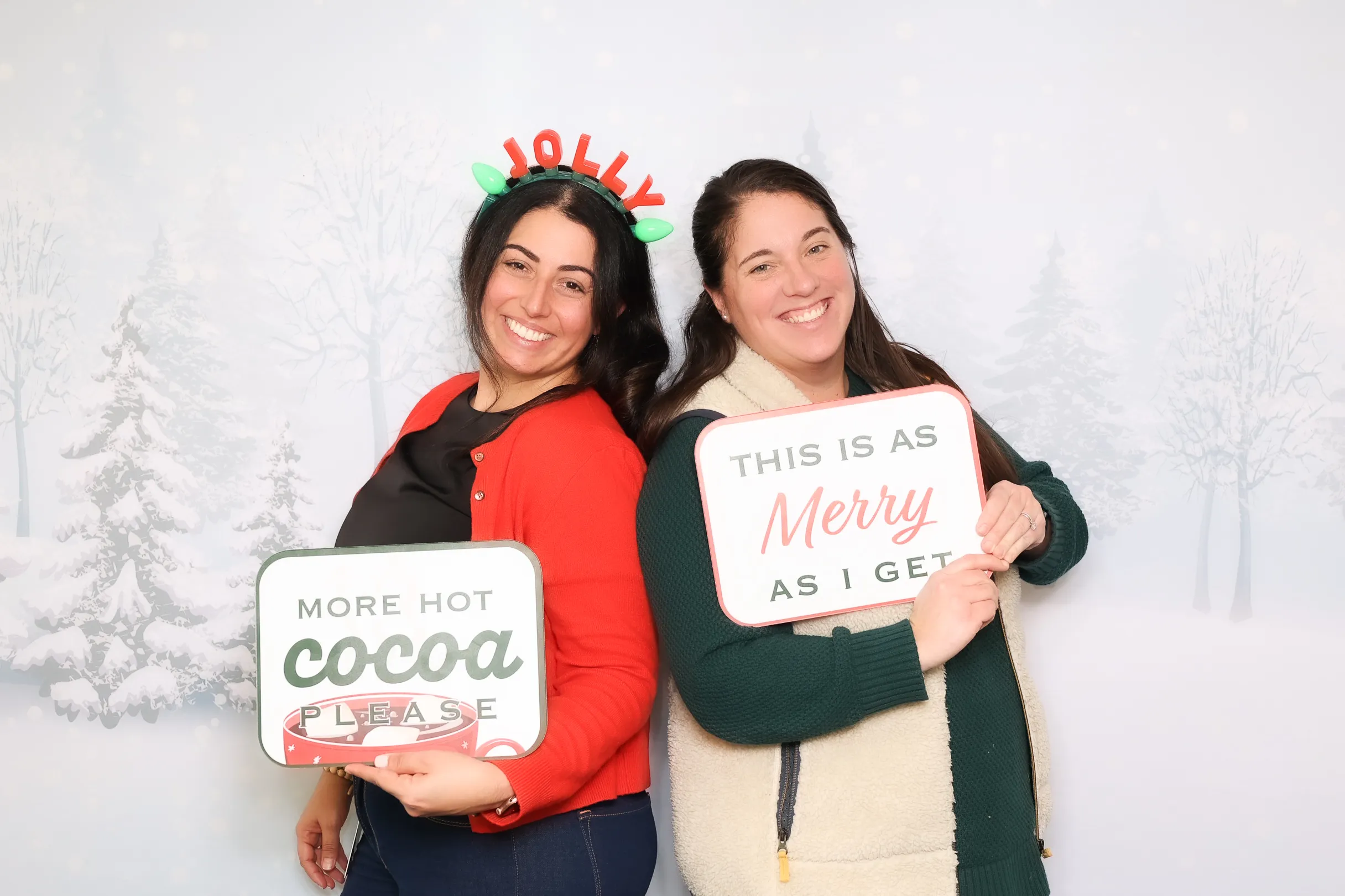 Guests laughing together at event photo booth