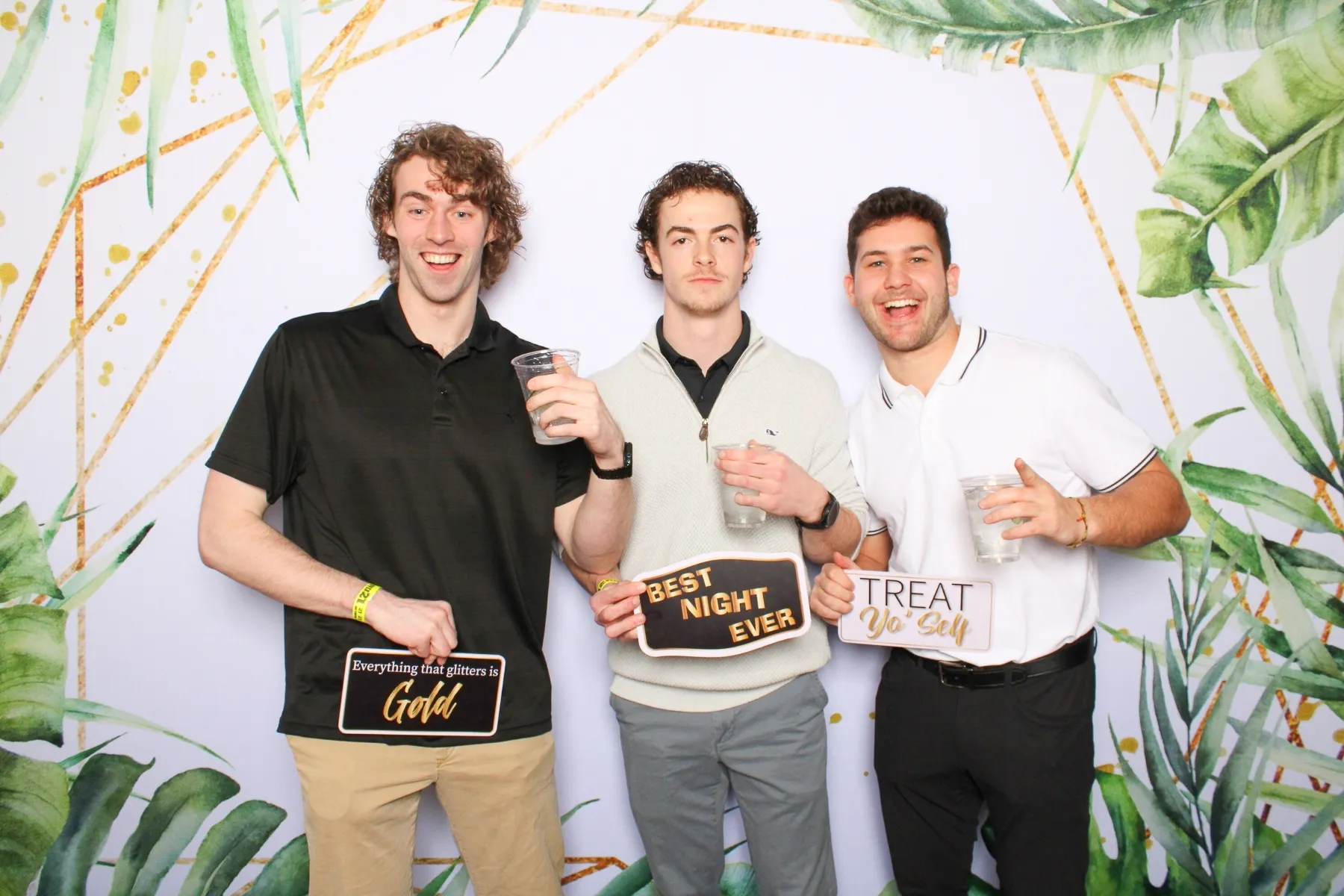 Tropical palm frame backdrop at photo booth