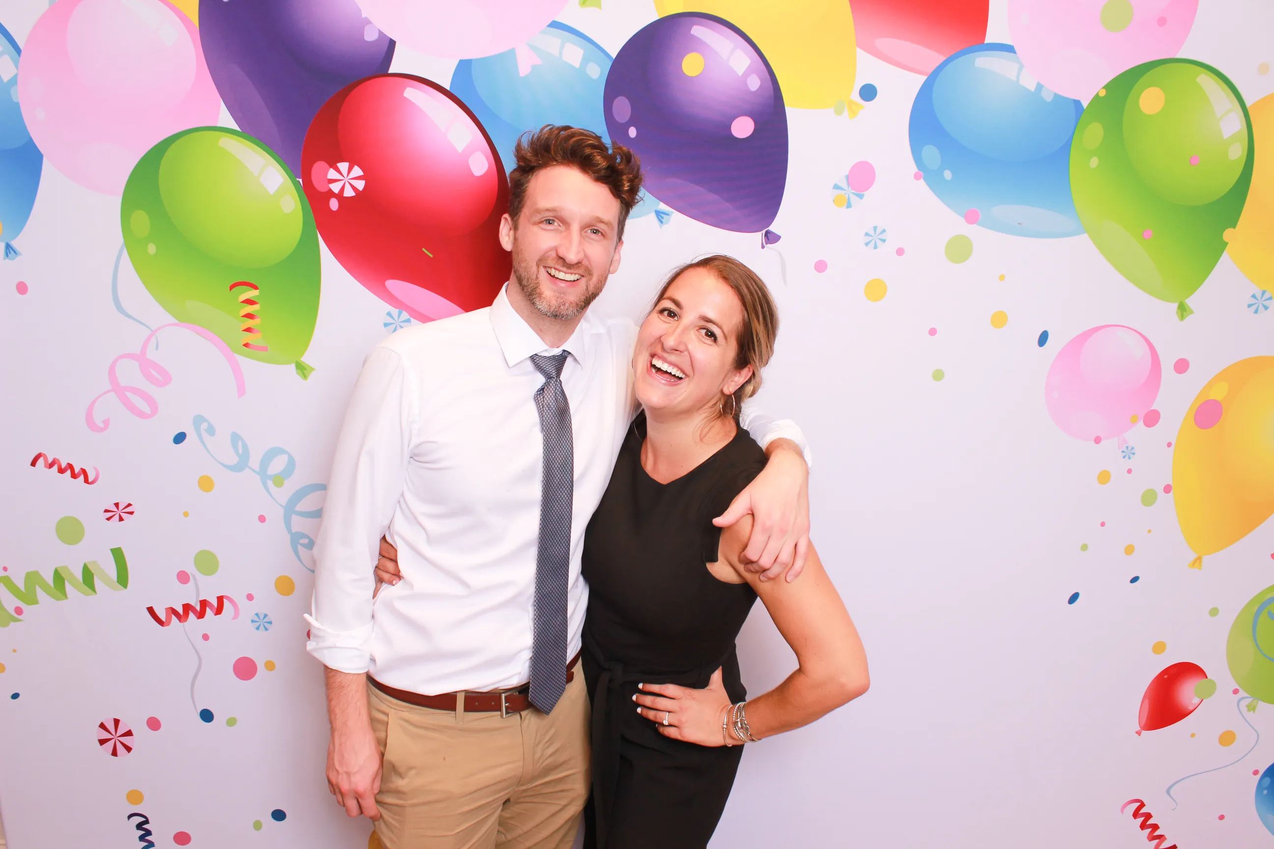 Colorful party time backdrop at photo booth