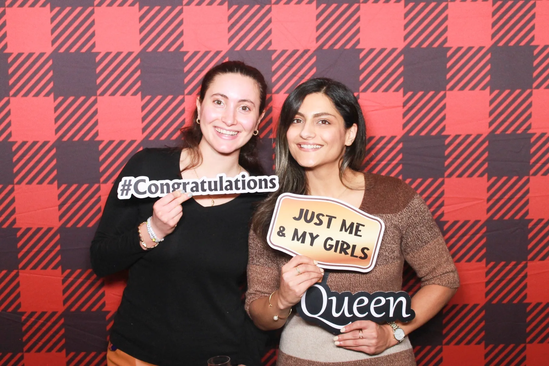 Photo booth with festive plaid backdrop